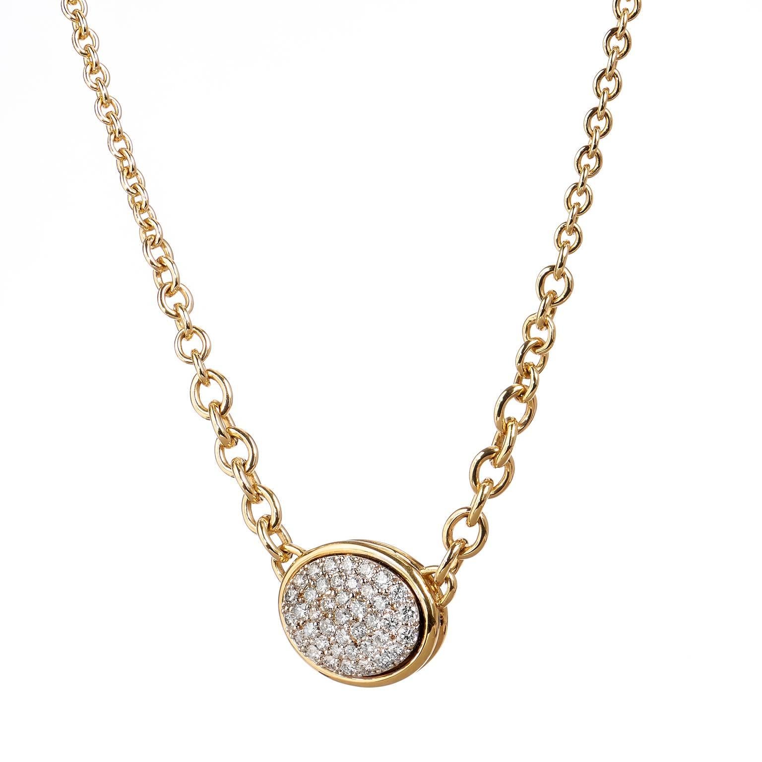 1.99 carats of Diamonds Set in 14 karat Gold Oval Shaped Pave Necklace 17 inches

This necklace showcases an oval shape pendant that features 1.99 carats of G-SI graded pave set diamonds for scintillating appeal upon the neck. The pendant is