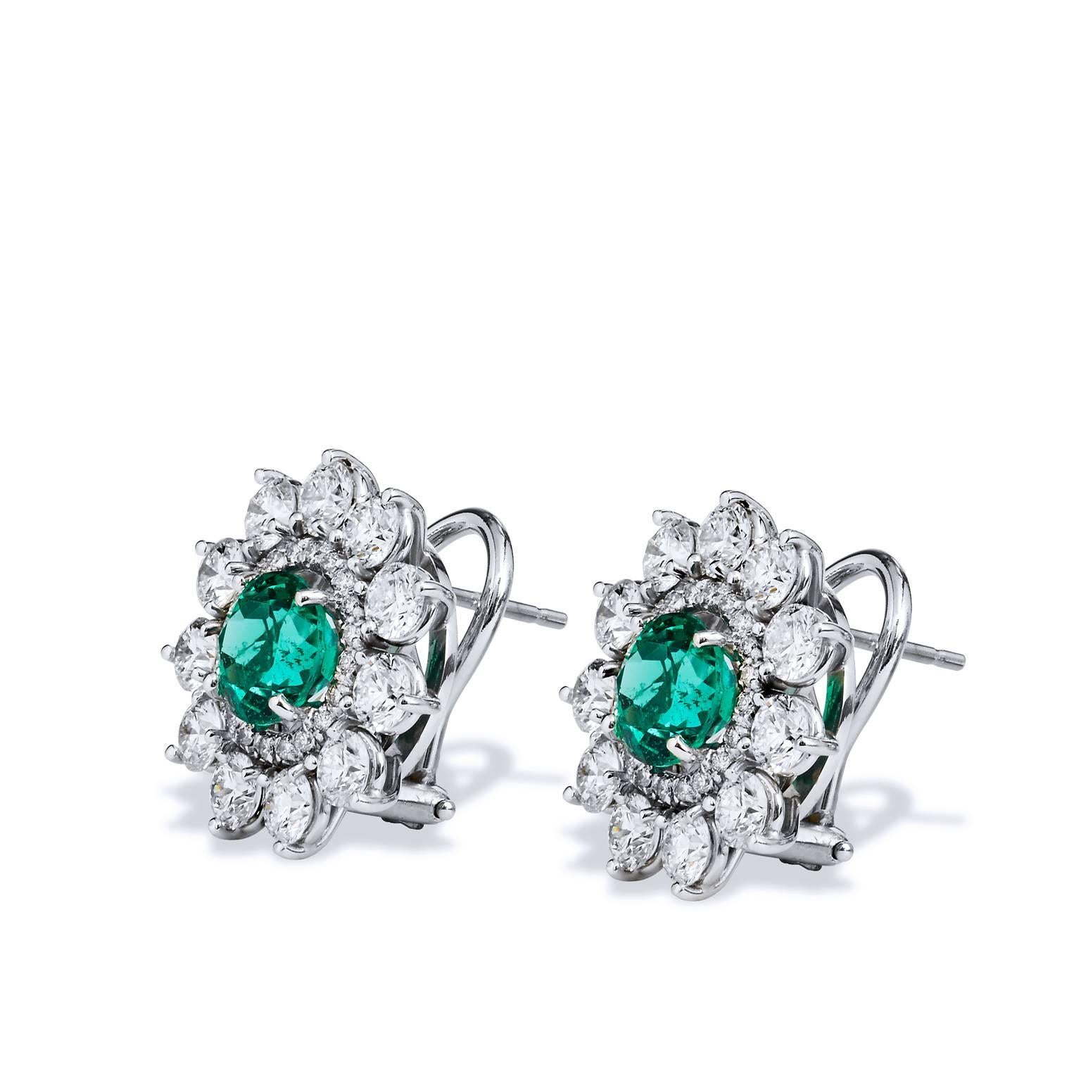 2.69 Carat Zambian Emerald with 3.46 Diamond Earrings in 18 karat White Gold

Handcrafted by H&H Jewels, these stunning earrings are created with 18 karat white palladium and feature a total of 2.69 carats of Zambian Emeralds. 

The center gemstones