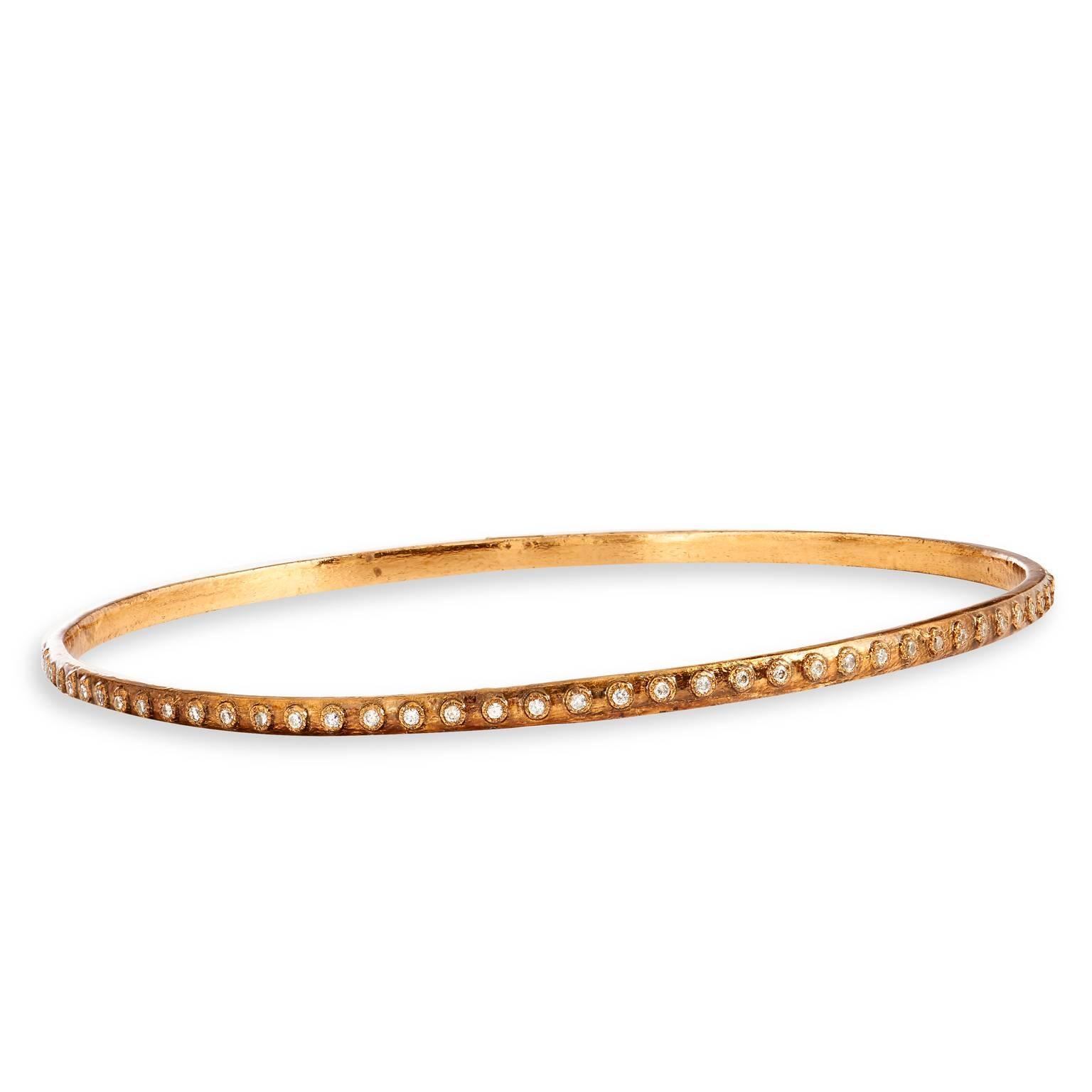 This Armenta bronze bangle is a part of the Aurora collection and features diamonds set on a 1mm wide bracelet.