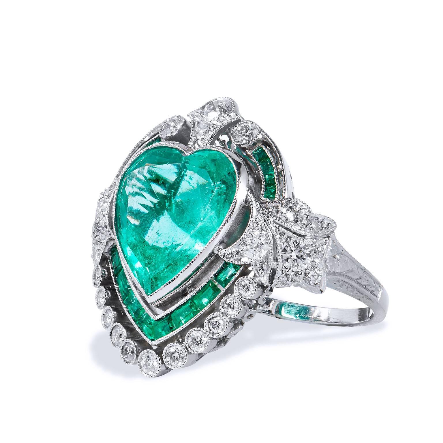 Art Deco Inspired 5.87 Carat Heart Shaped Colombian Emerald and Diamond Platinum Ring

This amazing ring has been handcrafted in platinum, this is a new ring that has been created in an Art Deco style.  
It features a stunning 5.87 carat Colombian