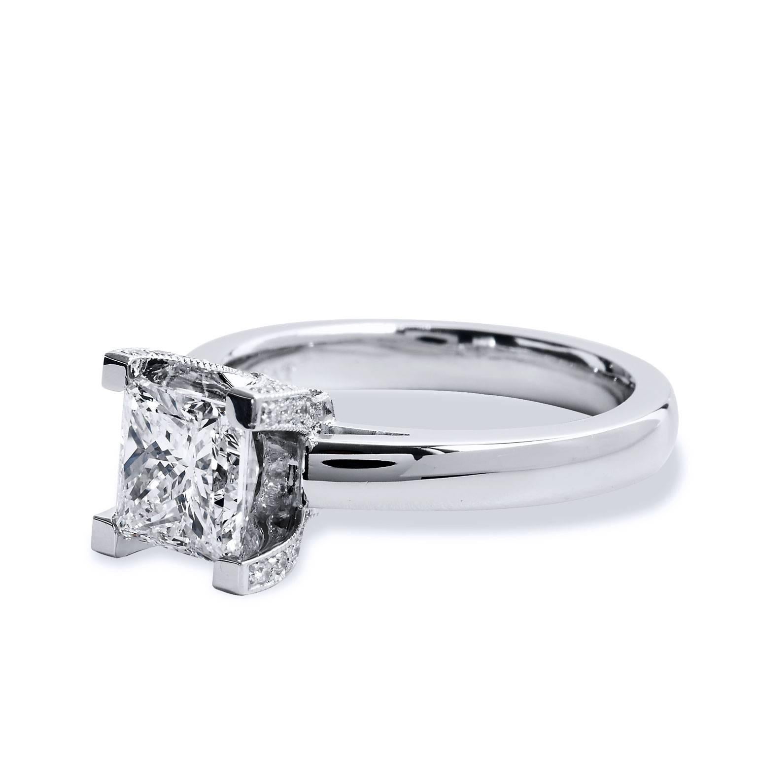 Crafted in platinum, this engagement ring features a 1.70ct H VVS2 Princess cut diamond. The solitaire diamond is set in a pave prong design. The ring is complete with .21ct of fine G/H VS diamonds set pave on each prong for elevated beauty. This is
