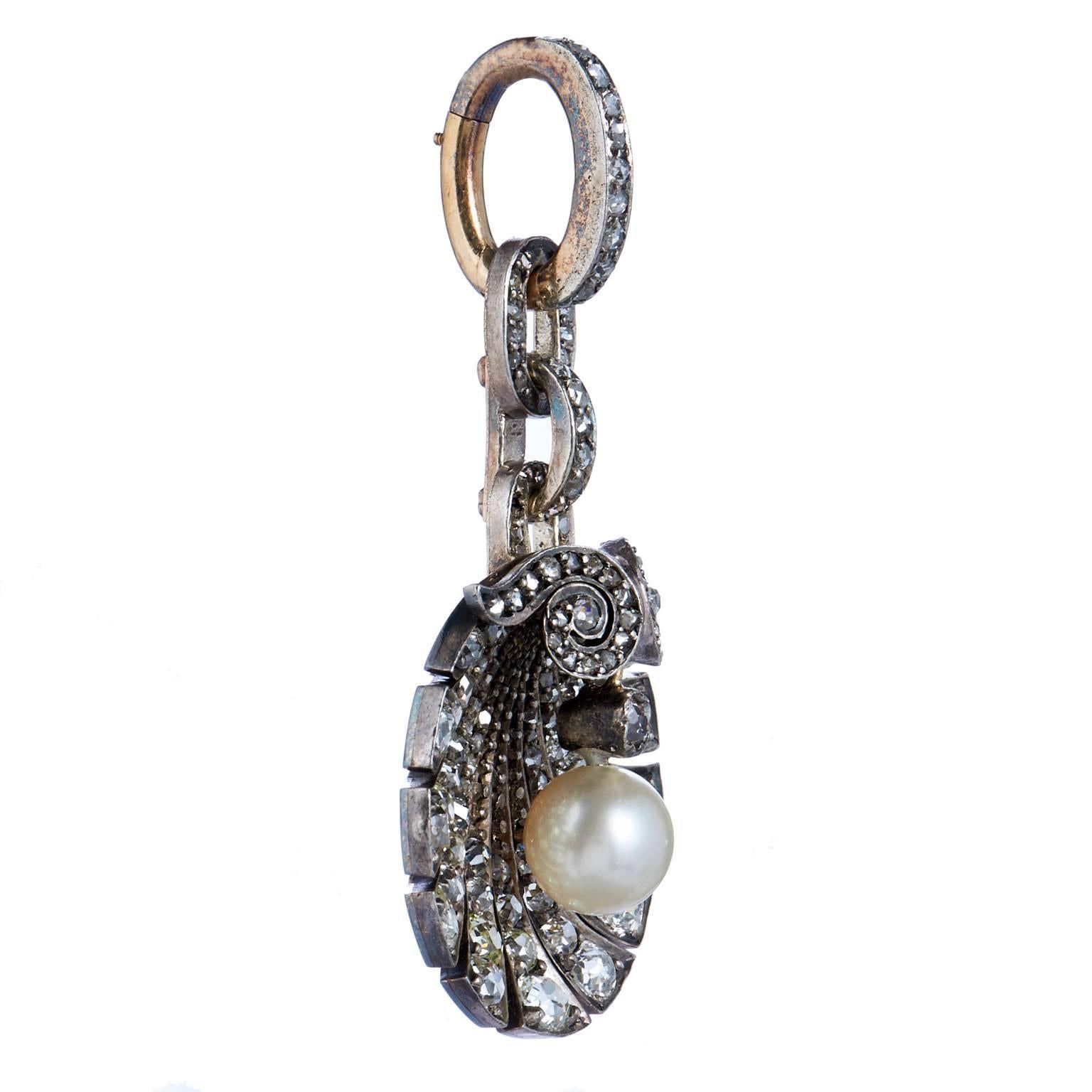 Georgian 7.3 mm White Pearl & 2.50-3.00 Carats of Diamonds Silver & Gold Pendant

A stunning piece from the Georgian Era, this pendant showcases the traditional Georgian design with a gold top and silver bottom.
It features an authentic French