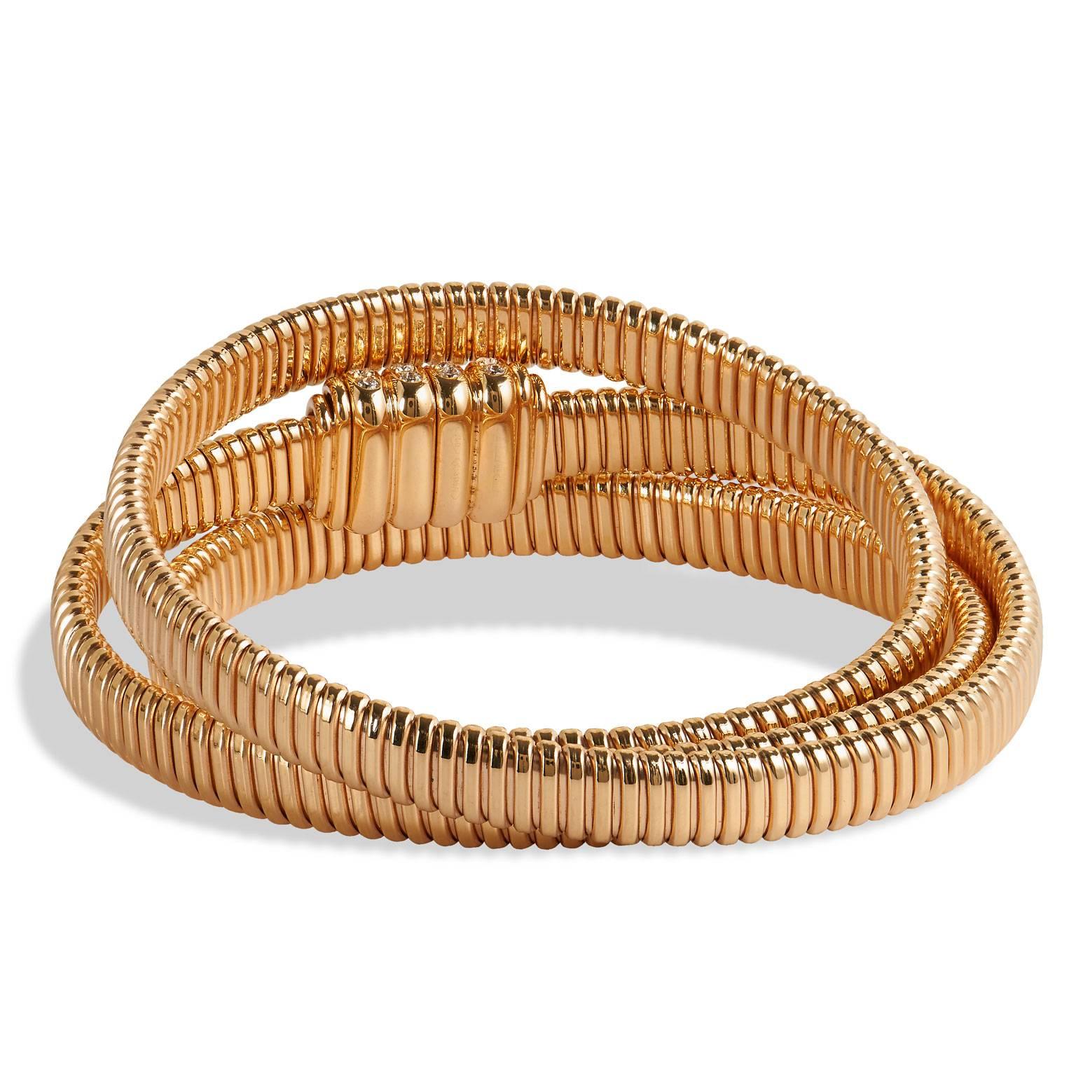 Diamond Gold Wrap Bracelet with Diamond Clasp

This handmade Italian bracelet wraps the wrist in 18 karat rose gold. For an elevated look, the bracelet is complete with .62 carats of round cut diamonds that are set amidst the magnetic clasp.

It