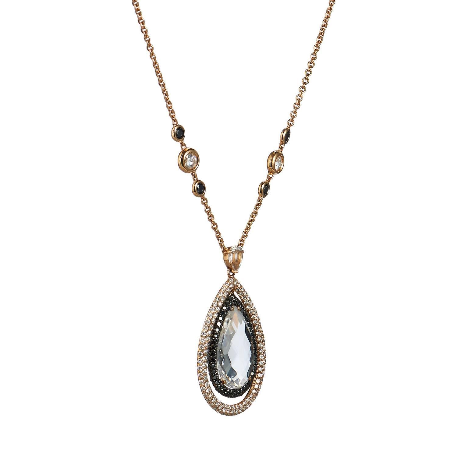 A beautiful statement piece, this Italian necklace features an impressive 8.50ct topaz suspended by an 18kt rose gold chain. Stations of black diamonds totaling 1.86ct and white diamonds totaling 2.52ct graded G-SI creates a glistening design upon
