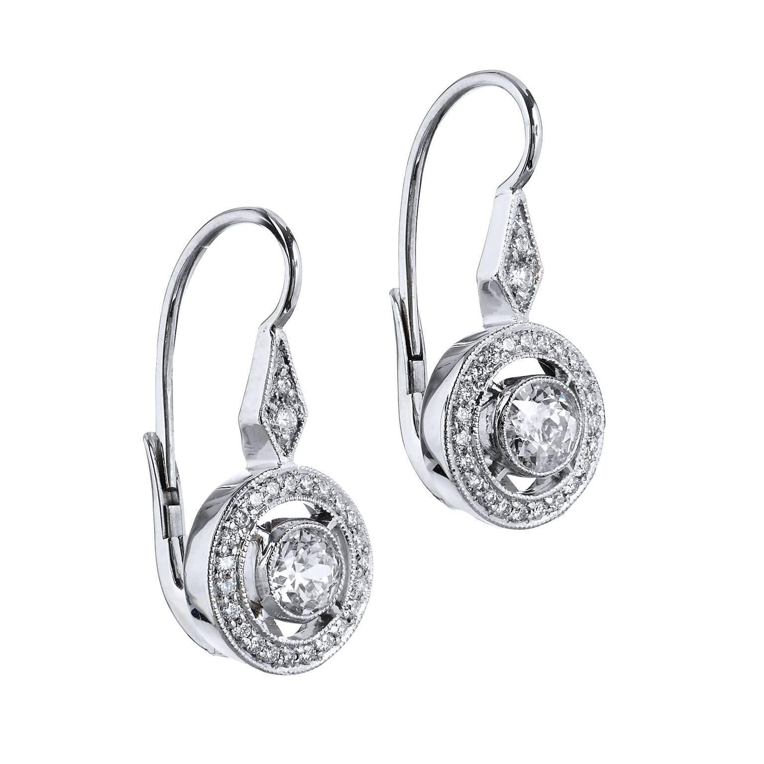 She will treasure these desirable Old European Cut Diamonds married in new eighteen karat white gold leverback earrings. The center diamonds are bezel set and  weight .63 carats TW , G/H Color, VS2/SI1 Clarity
True to the time these earrings feature