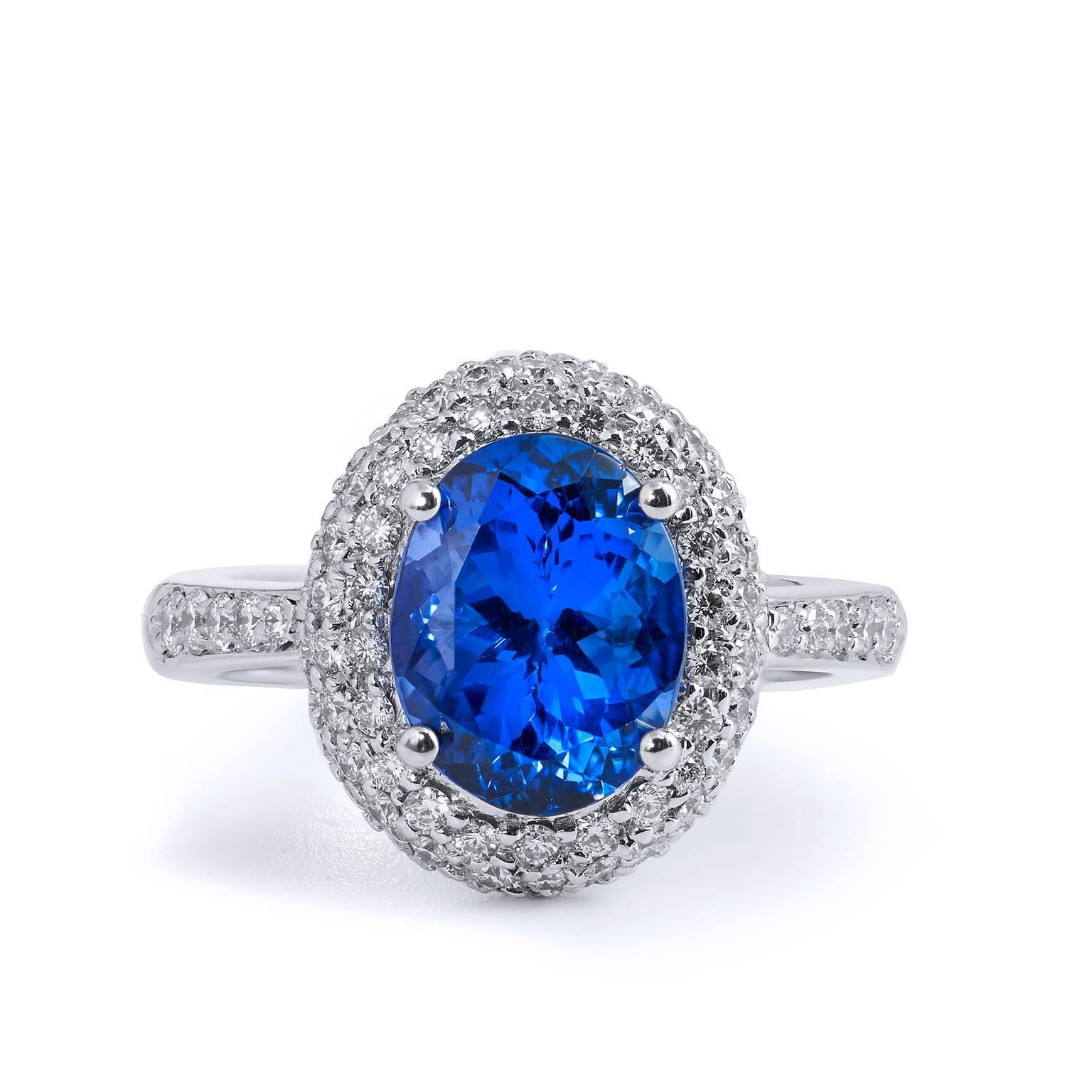 Handmade H&H 3.19 Carat Tanzanite and Diamond 18 karat Gold Ring 

This is a handmade ring by H&H Jewels.  

You will not be able to stop looking at this large and bright vivid blue 3.19 carat oval fine cut Tanzanite that is handcrafted in 18 karat