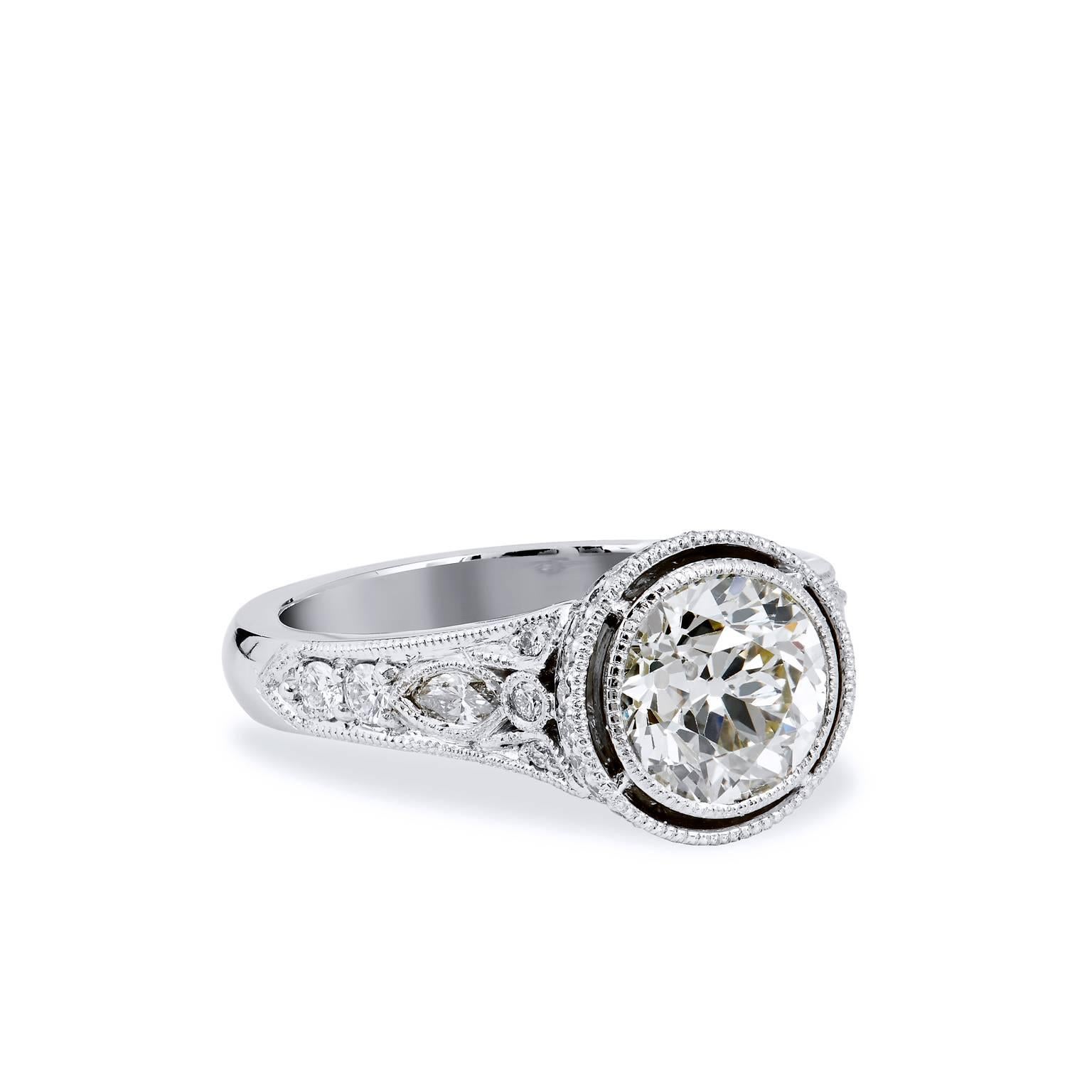1.76 carat Bezel Set Diamond with Pave & Marquis Platinum Engagement Ring

This is a handmade ring by H&H Jewels.  It evokes the feeling of yesteryear with this lovely platinum and Old European cut diamond engagement ring.  A hand-cut 1.76 carat Old