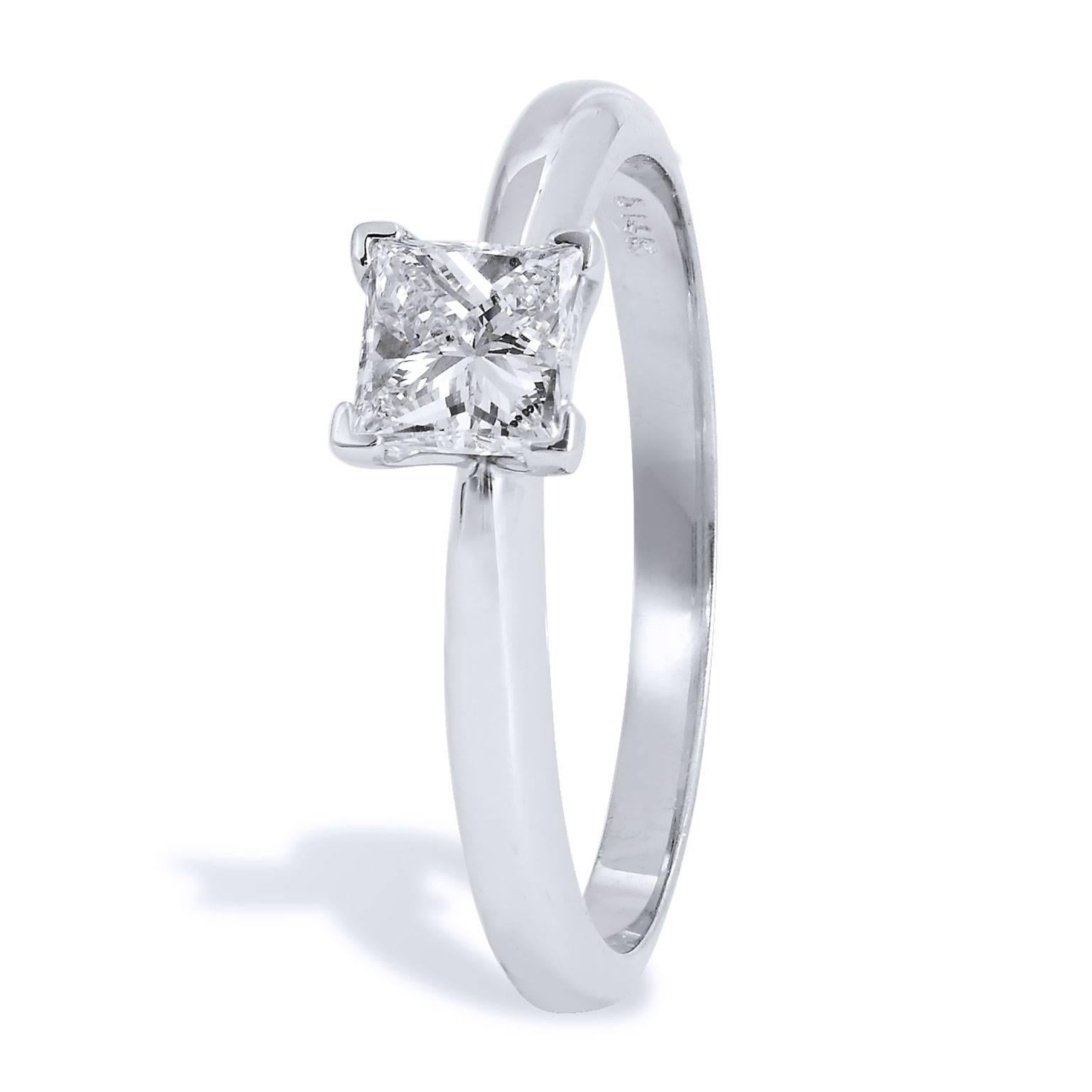 An engagement ring that will make her heart swoon. A 0.60 carat princess cut diamond solitaire (K/SI2) set on a 14 karat white gold reverse tapered shank exudes fun and self-assurance. The modern square shape of the princess cut diamond presents
