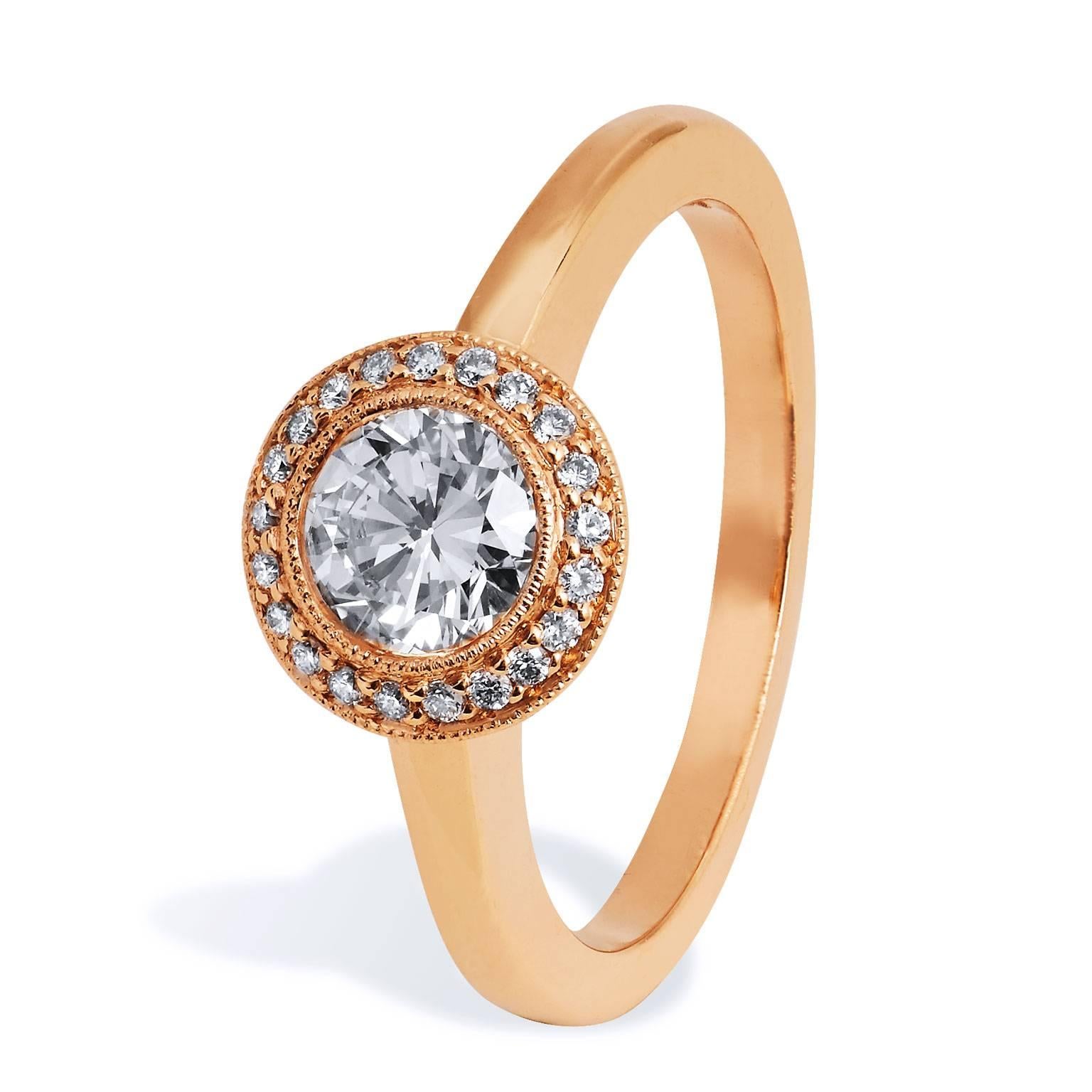 Handmade Round Brilliant Cut Diamond Gold Engagement Ring

Warm, rich rose gold smolders with luxury in this 14 karat rose gold 0.65 carat round brilliant cut diamond engagement ring. Twenty-one pieces of diamonds pave set (weighing 0.08 carats