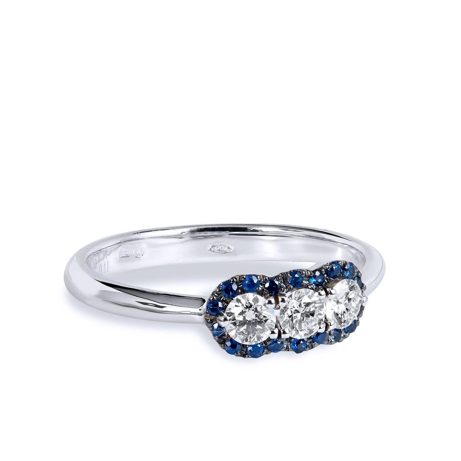 Three Diamond Blue Sapphire Pave White Gold Ring

This 18 karat white gold three stone ring features three diamonds at center with a total weight of 0.34 carat (G/SI1) and blue sapphires pave set (total weight 0.11 carat) around center diamonds add