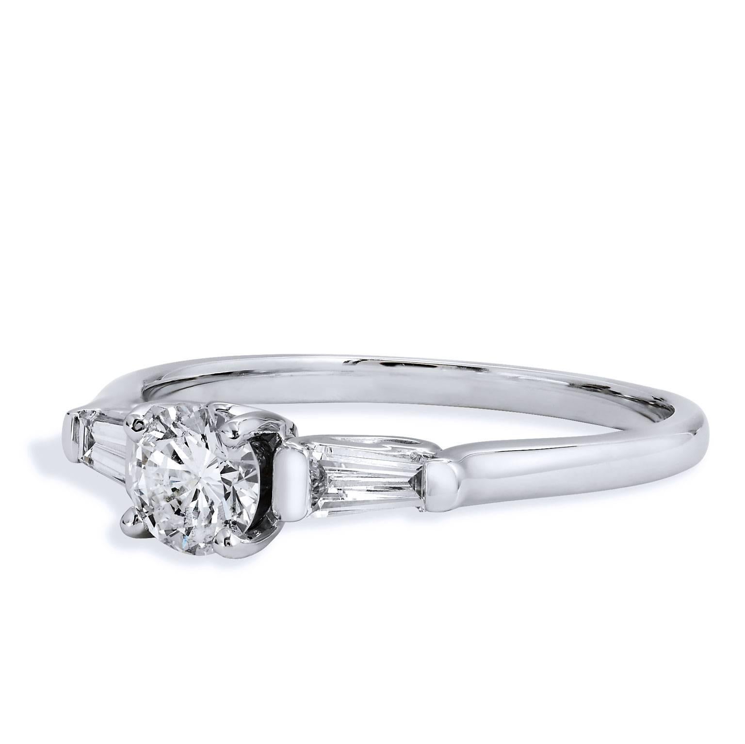 0.40 Carat Round Brilliant Cut 7 Baguette Diamond White Gold Engagement Ring

This is a handmade ring by H&H Jewels it has 14 karat white gold and features a 0.40 carat round brilliant cut diamond at center, with while two baguette cut diamonds,