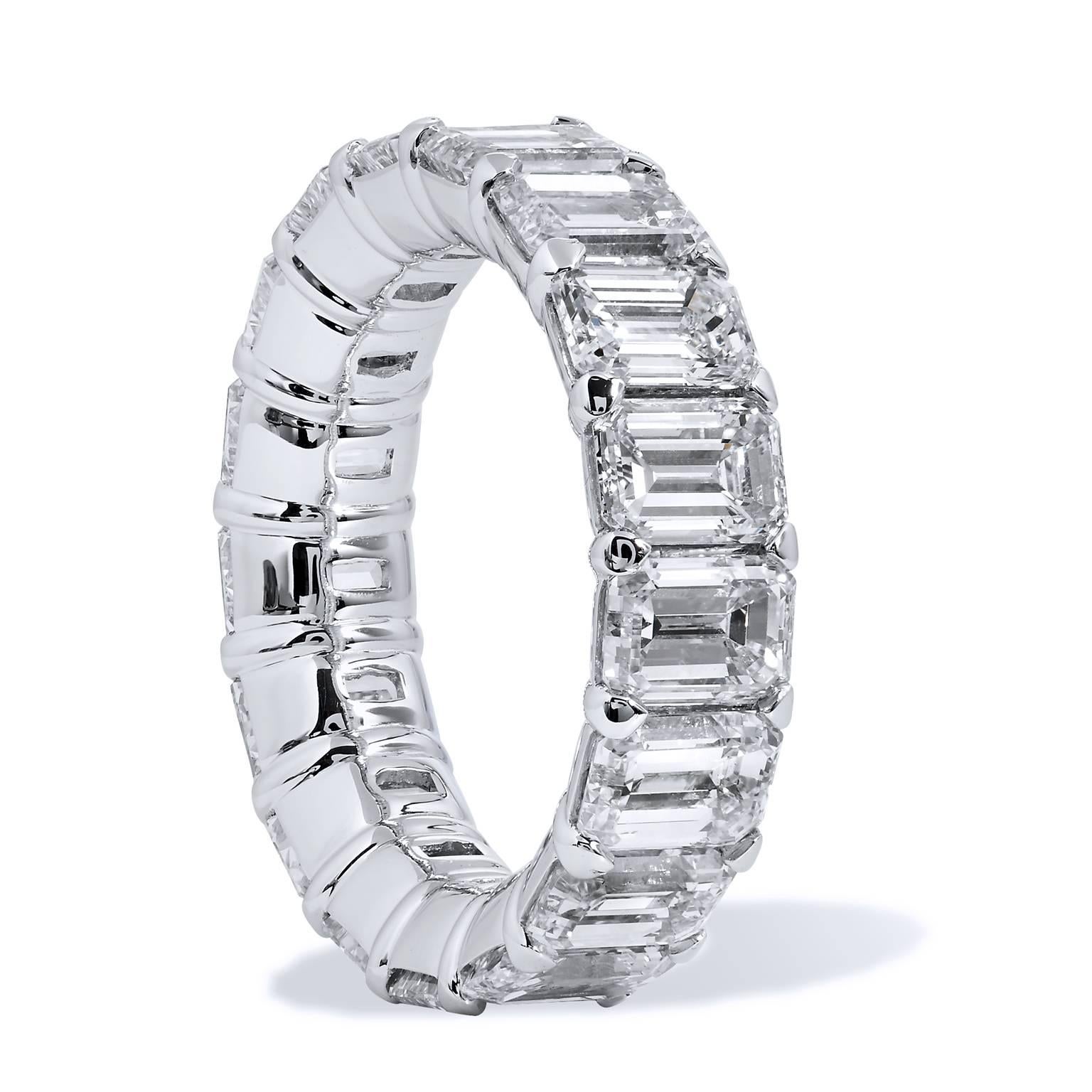 Seventeen emerald cut diamonds (G/VS), with a total weight of 9.92 carats, are affixed to a platinum shared-prong shank. This buttercup eternity band provides a spectrum of light and color that glinters with pristine beauty. A light that will light