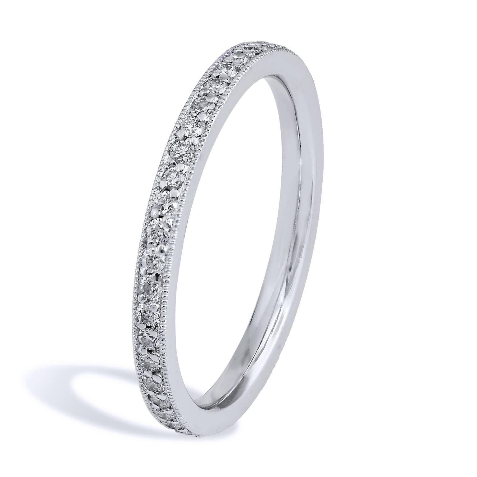 This band ring features 0.36 carat of round diamonds (G/H/VS) pave set. Affixed to a platinum band with milgrain work, this 1.90 mm thick ring provides a mosaic of light and color that twinkles with remarkable beauty.