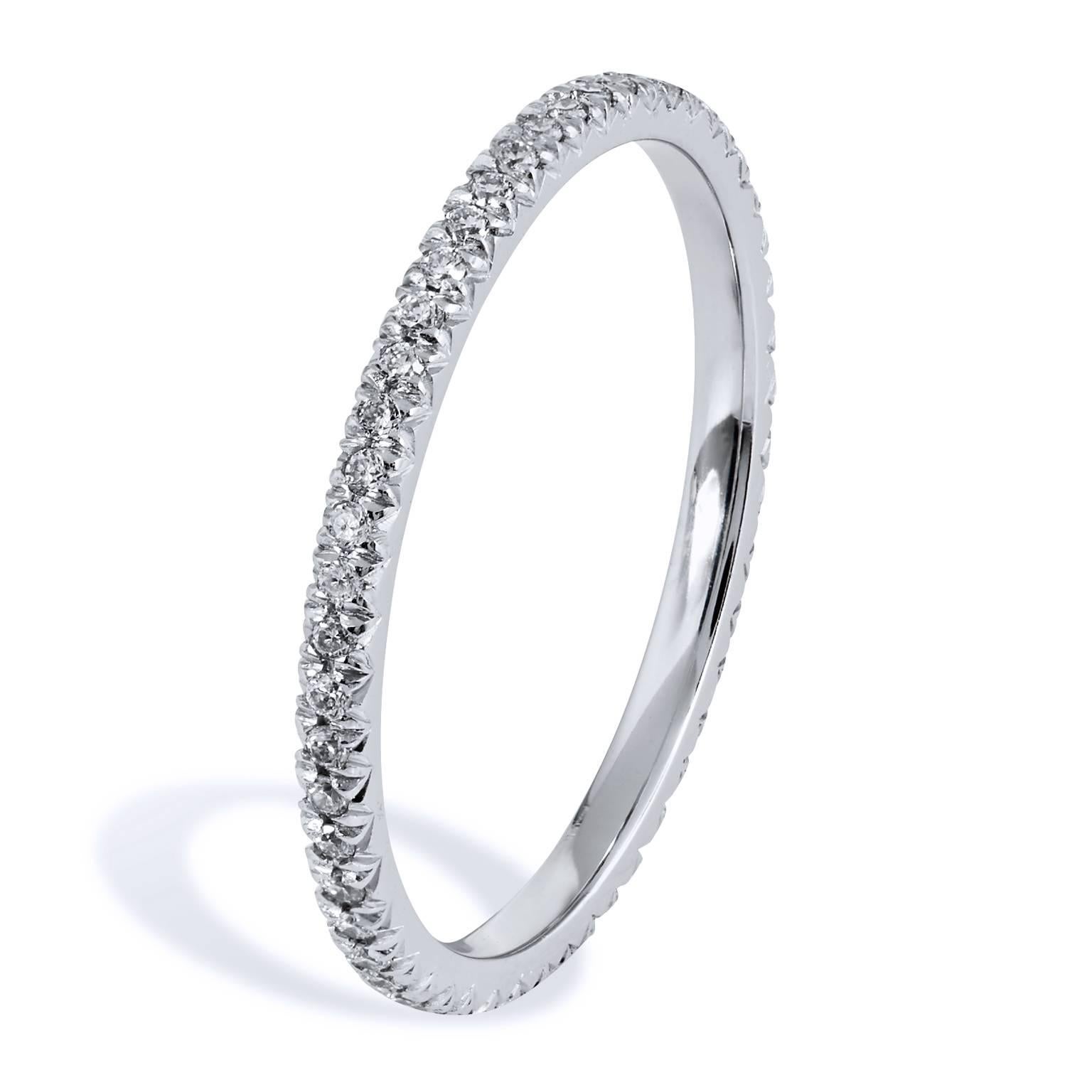 This diamond band ring features fifty pieces of diamond pave set with a total weight of 0.22 carat (G/H/VS). Affixed to a 1.5 mm 18 karat palladium band, the split V detail, opens the eye, allows the ring to pop with light.