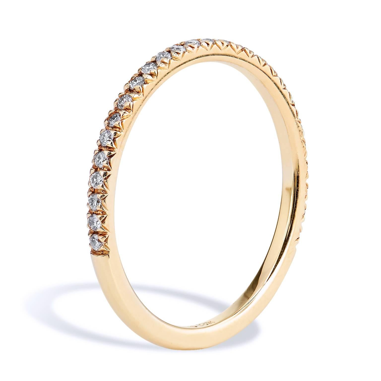 This diamond band ring features twenty-seven pieces of diamond pave set with a total weight of 0.14 carat (G/H/VS). Affixed to a 1.50 mm 18 karat yellow gold band, the split V detail, opens the eye, allows the ring to pop with light.
