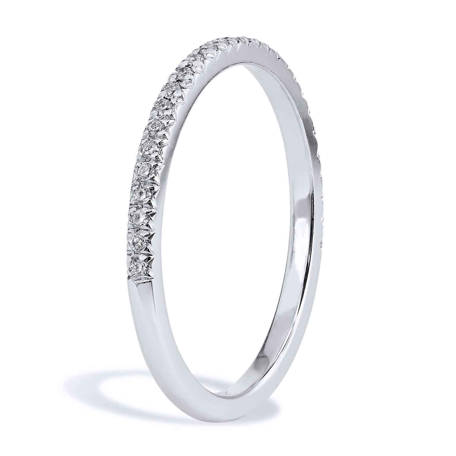 This diamond band ring features twenty-seven pieces of diamond pave set with a total weight of 0.11 carat (G/H/VS). Affixed to a 1.50 mm 18 karat white palladium band, the split V detail, opens the eye, allows the ring to pop with light.