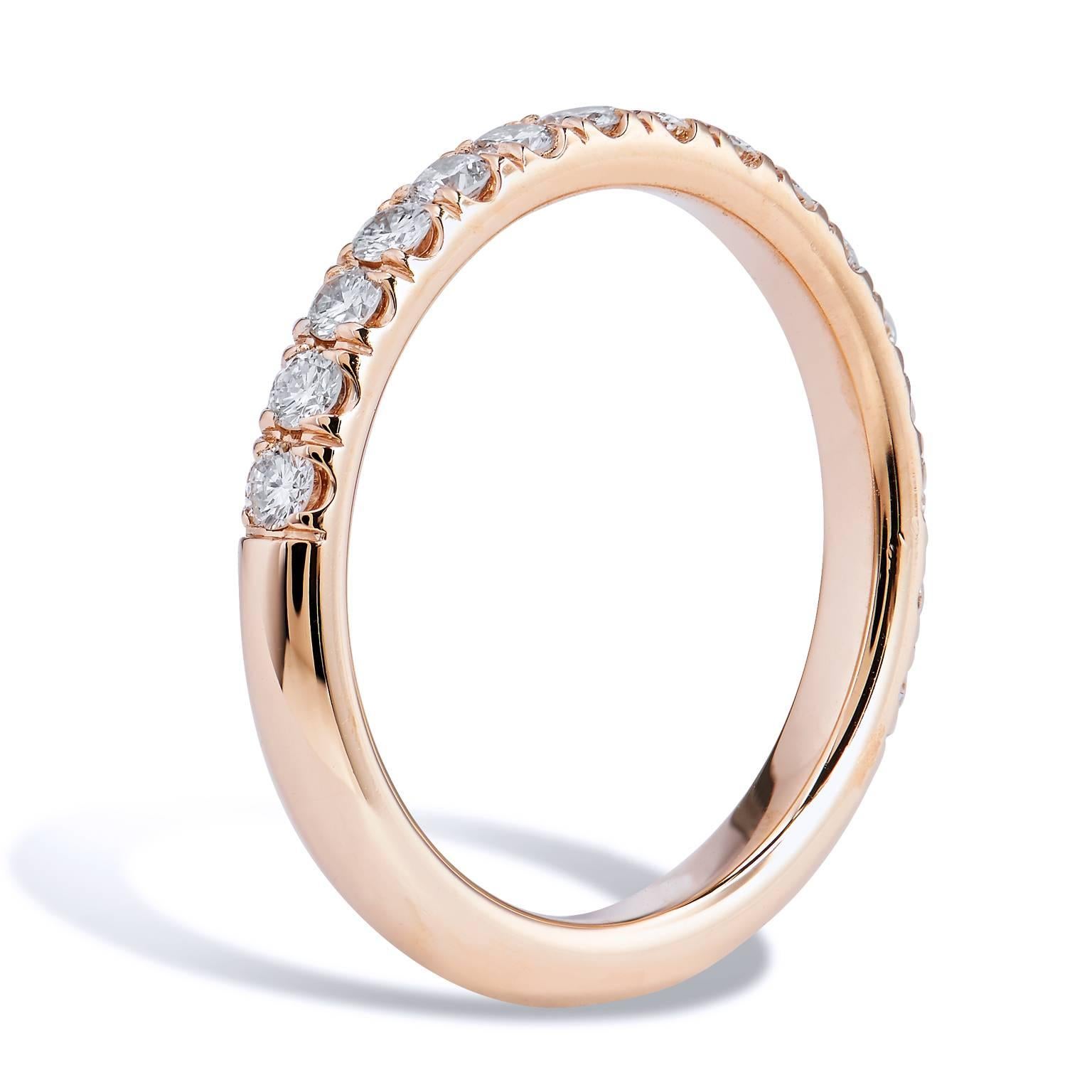 This diamond band ring features sixteen pieces of diamond pave set with a total weight of 0.44 carat (F/G/VS). Affixed to an 18 karat rose gold band, the split V detail, opens the eye, and allows the ring to pop with light.