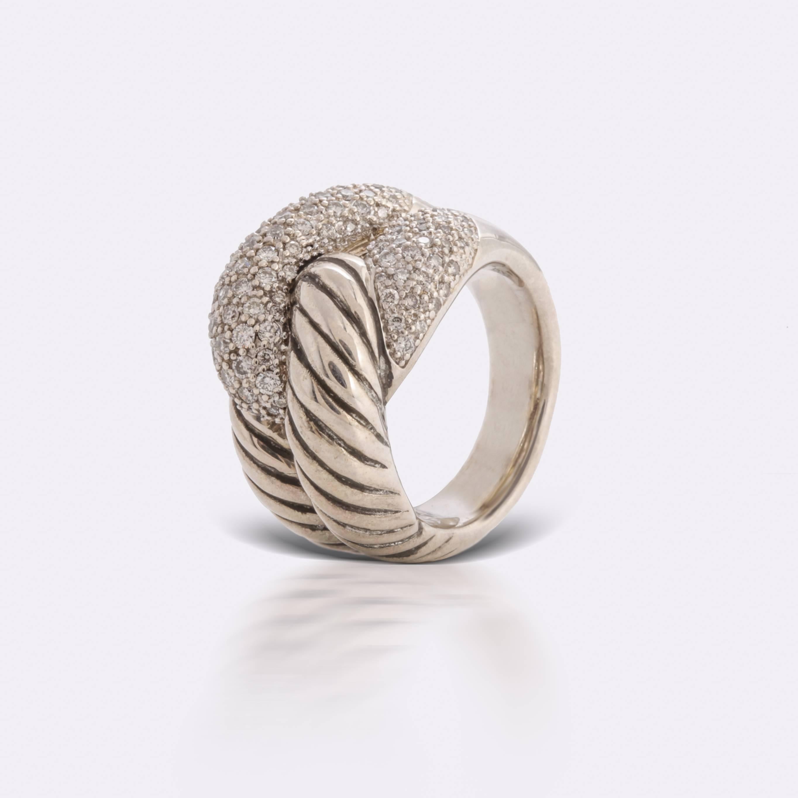 Previously loved, sterling silver David Yurman Infinity Cable cocktail ring featuring 0.85 carat of diamond pave set on 14 karat gold interlocking details, cable texture, and split tapered shank at each side (size 7).