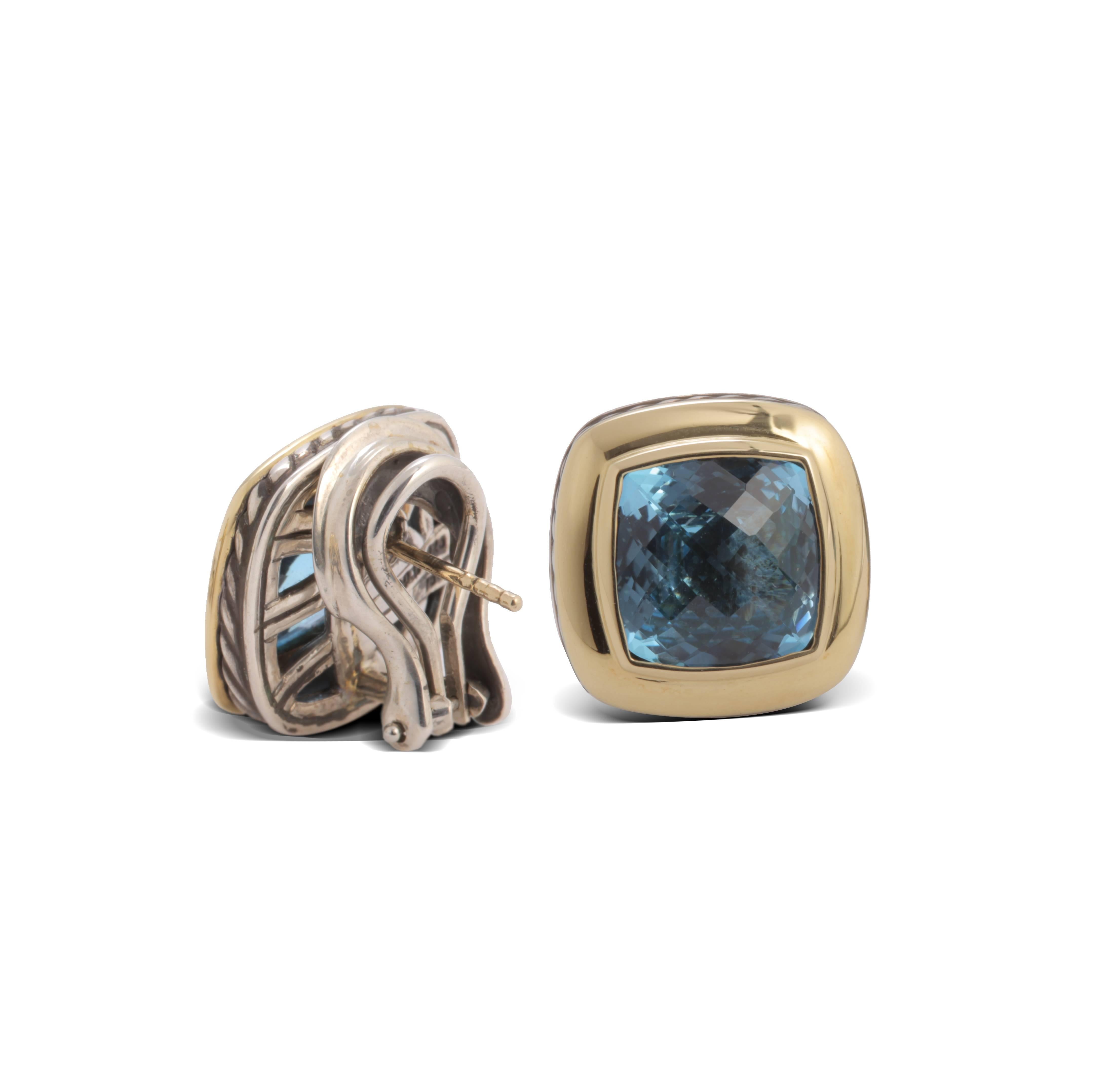 Previously loved sterling silver and 18 karat yellow gold David Yurman Albion earrings featuring blue faceted topaz accents at center and clutch back closures.