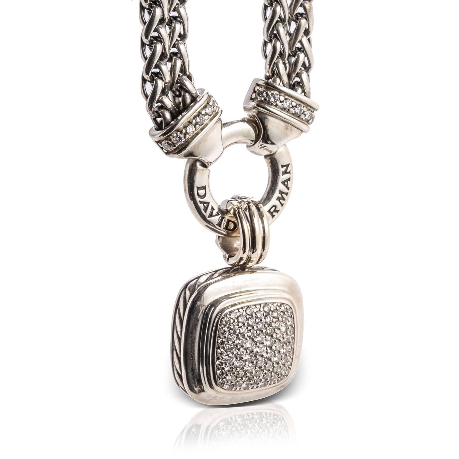 Previously loved, sterling silver David Yurman Albion pendant necklace featuring 1.00 carat of diamond pave bezel set at center. 18 karat white gold accents with 0.22 carat of diamond pave set, cable texture, hinged round bail, double strand wheat