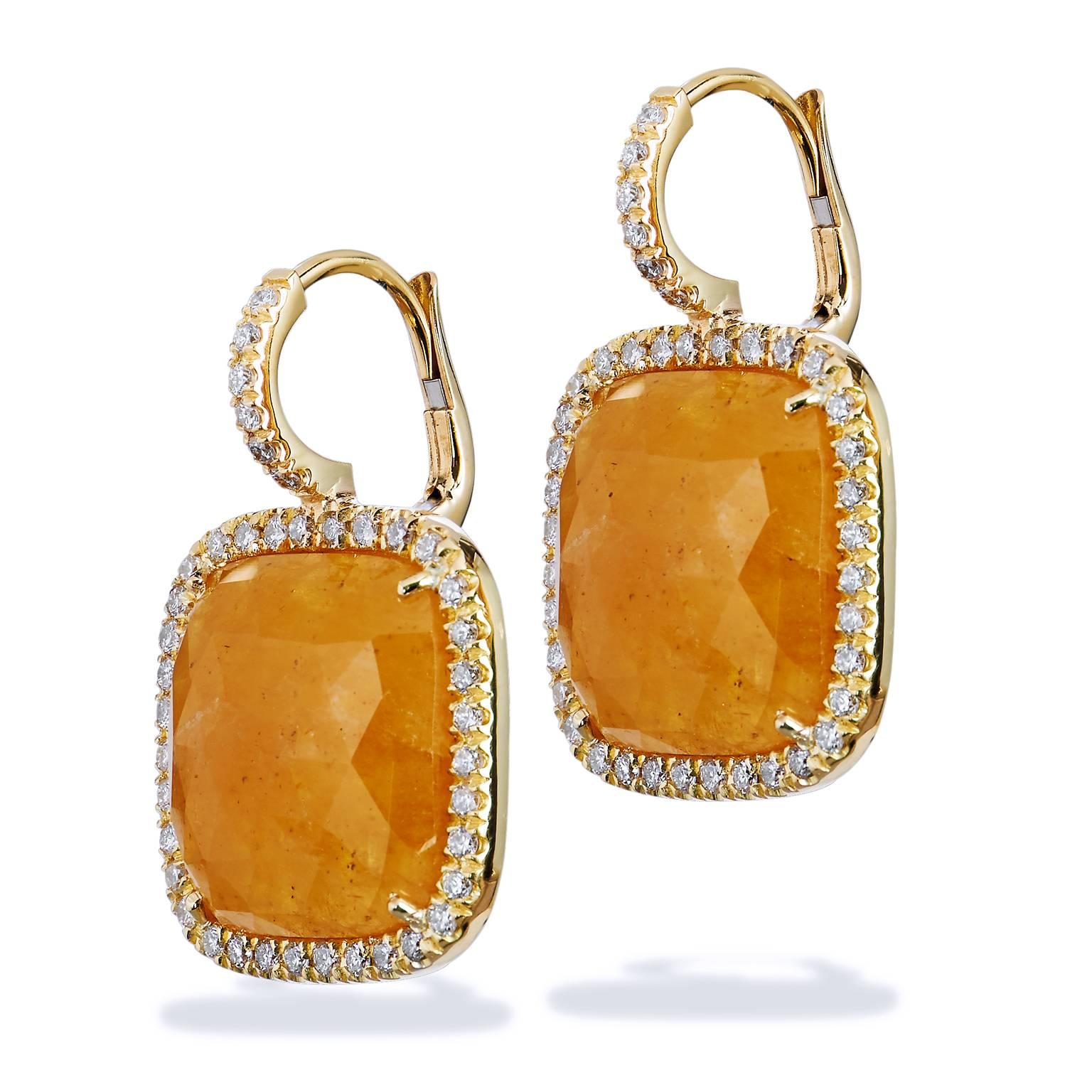 An original H and H design, these handcrafted 18 karat yellow gold earrings feature 13.58 carat of yellow sapphire slices. Slices provide an interesting presentation that allow the sapphire's natural beauty to be highlighted.  Cushion cut yellow