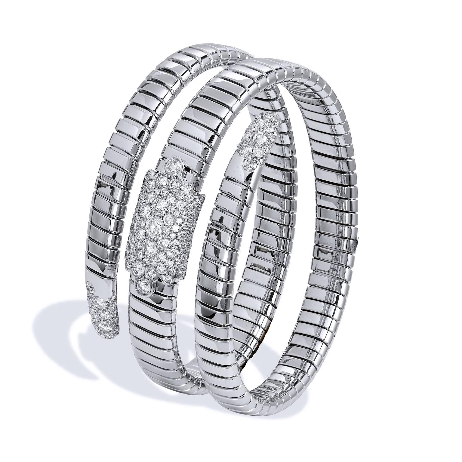 18 karat white gold stretchy coil bracelet featuring a total weight of 3.55 carat of diamond pave set (G/SI1).
