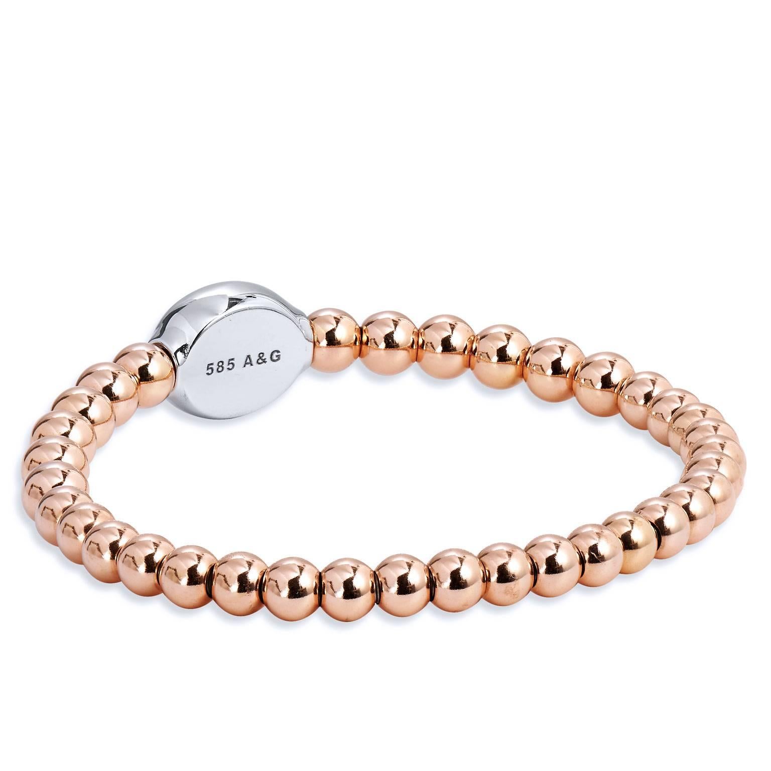 Bracelet with 14 karat rose gold beads (5mm to 5.5 mm bead size), white gold oval embellishment with 0.57 carat of diamond pave set and surgical steel insert.