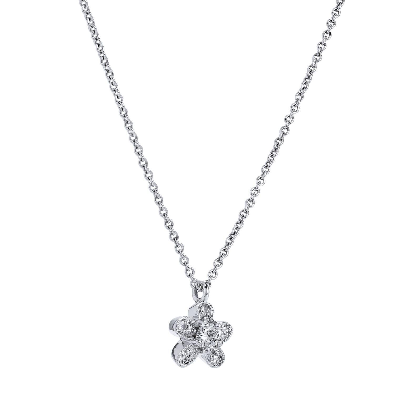 This sweet and simple H and H original design features platinum fashioned in the shape of a five petal flower.  0.24 carat of diamond pave set with milgrain work along the perimeter, exude a fun and playful energy in this darling flower charm