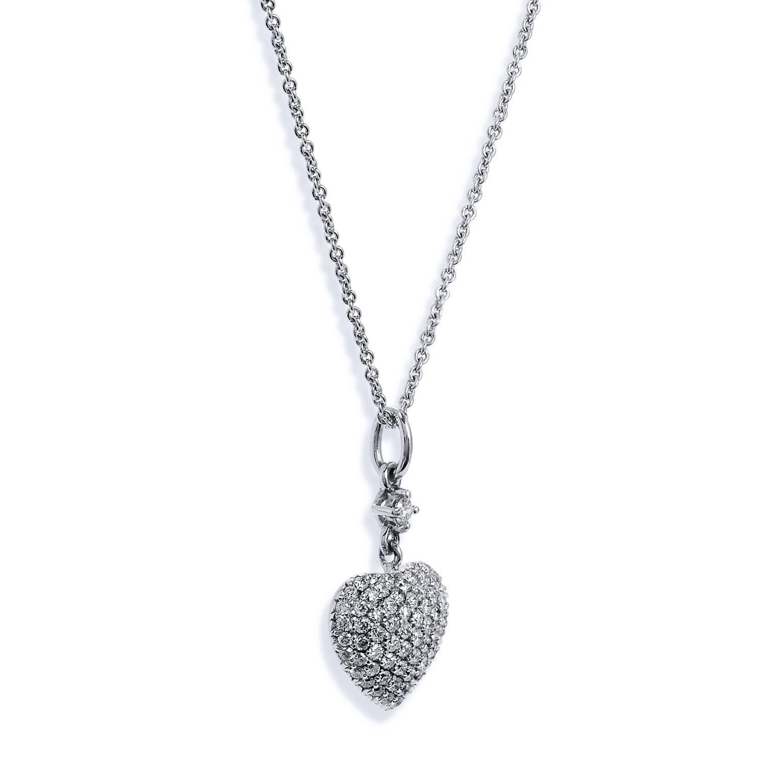 An H and H original design, this handmade 18 karat white gold pendant features seventy-five pieces of diamond with a total weight of 0.55 carat. Seventy-four pieces of diamond are pave set the expanse of the heart, while one diamond is prong set as