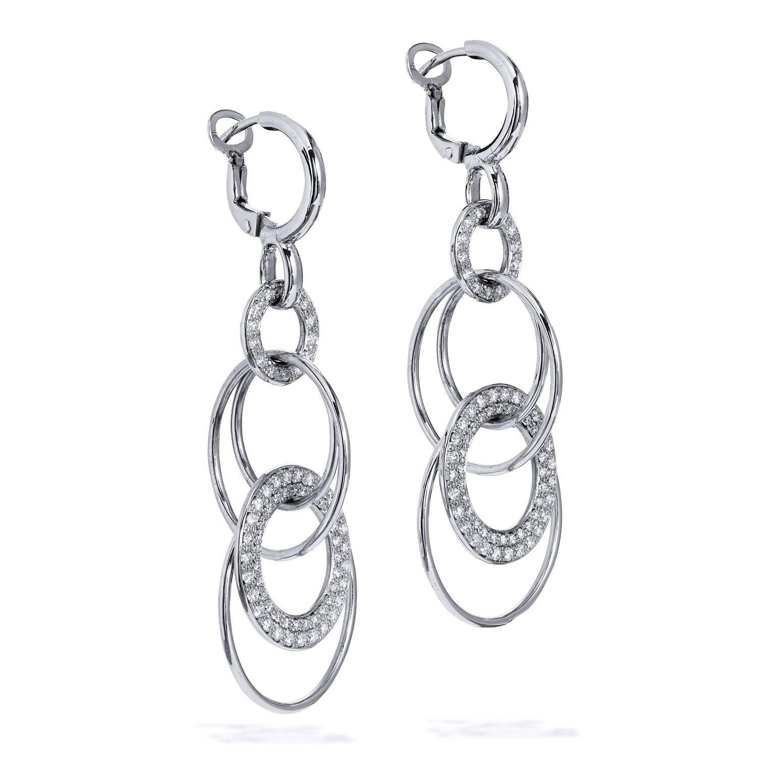 14 karat white gold dangle circus earrings featuring multiple interlaced circles and a total weight of 1.20 carat of diamond pave set.