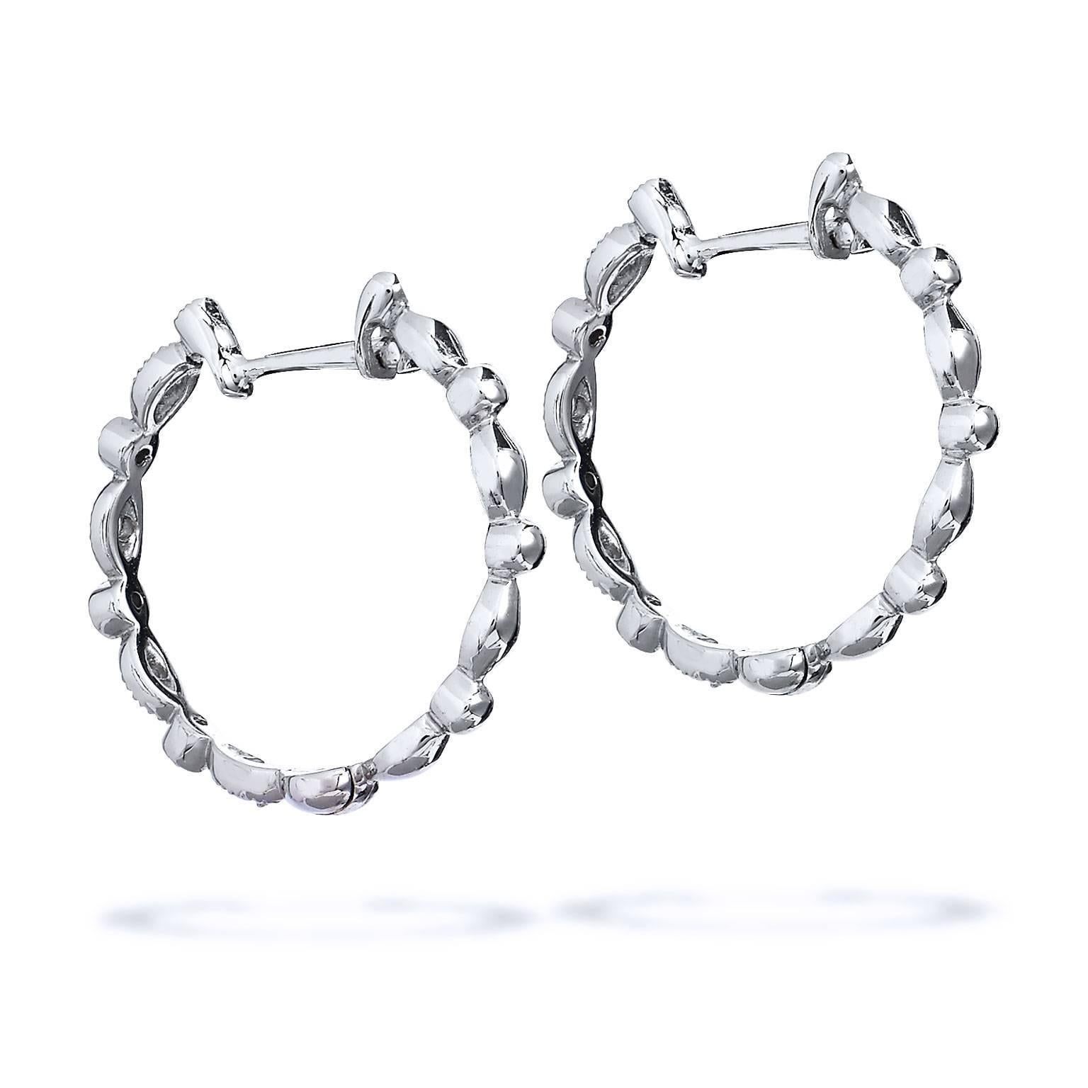 Jude Frances eighteen karat white gold diamond hoops. These Cleopatra style hoops hold sixteen round brilliant cut natural diamonds weighing a total of 0.16 carat.

Diameter 20 mm 
