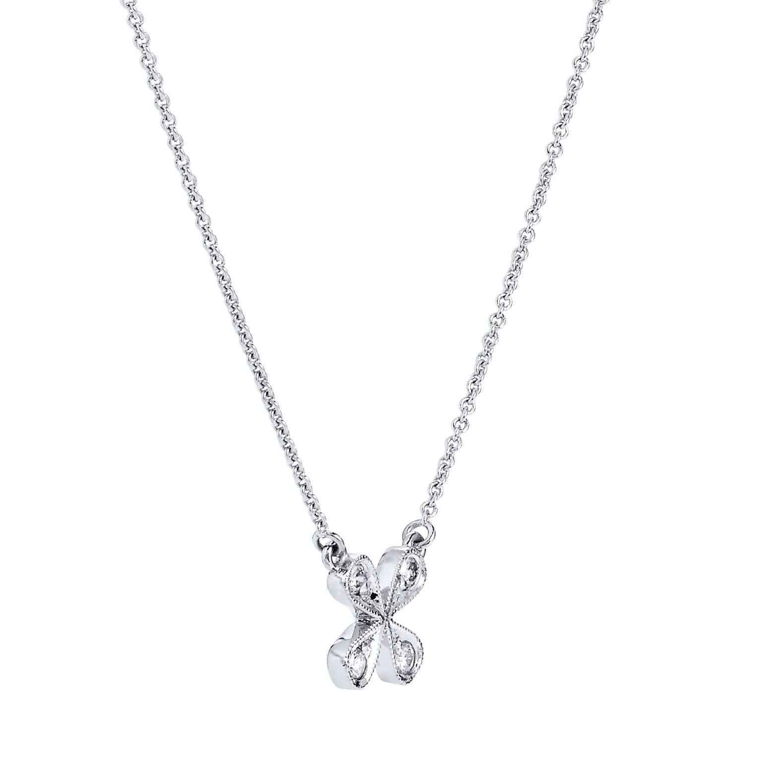 This sweet and simple H and H original design features 14 karat fashioned in the shape of a four petal flower. Diamonds, with a total weight of 0.07 carat (G/H/VS2/SI1), are pave set with milgrain work along the perimeter and hung on an 18 inch