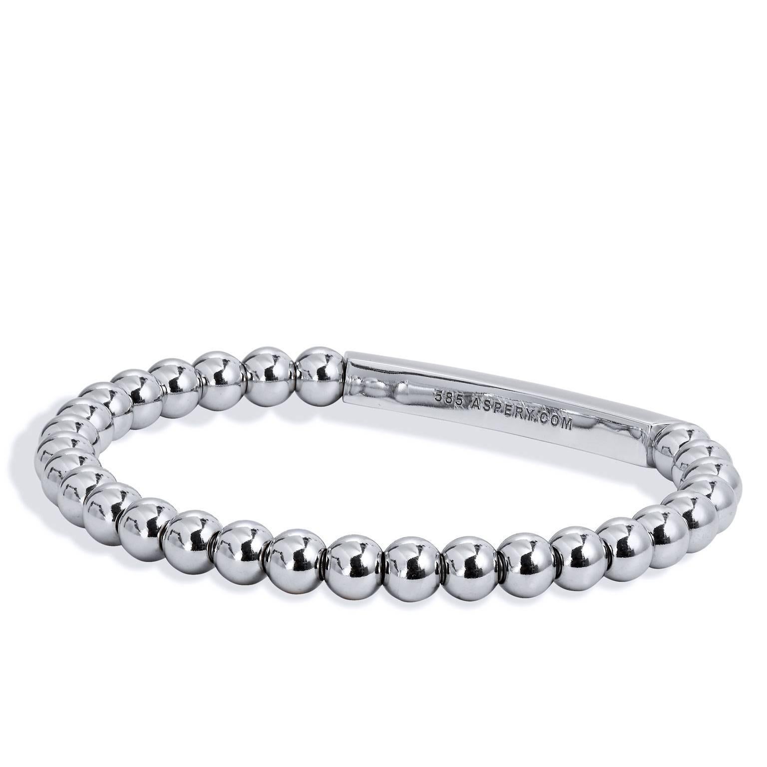 Bracelet with 14 karat white gold beads (5mm bead size), 14 karat white gold two-row rectangular bar embellishment with 0.68 carat of diamond pave set and surgical steel insert.