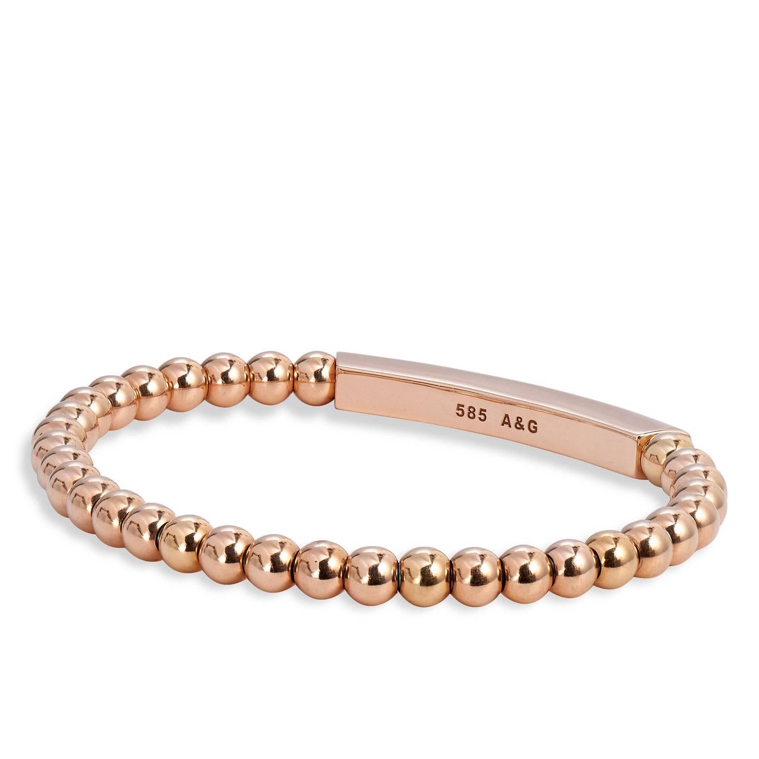 Bracelet with 14 karat rose gold beads (5mm bead size), 14 karat rose gold two-row rectangular bar embellishment with 0.68 carat of diamond pave set and surgical steel insert.