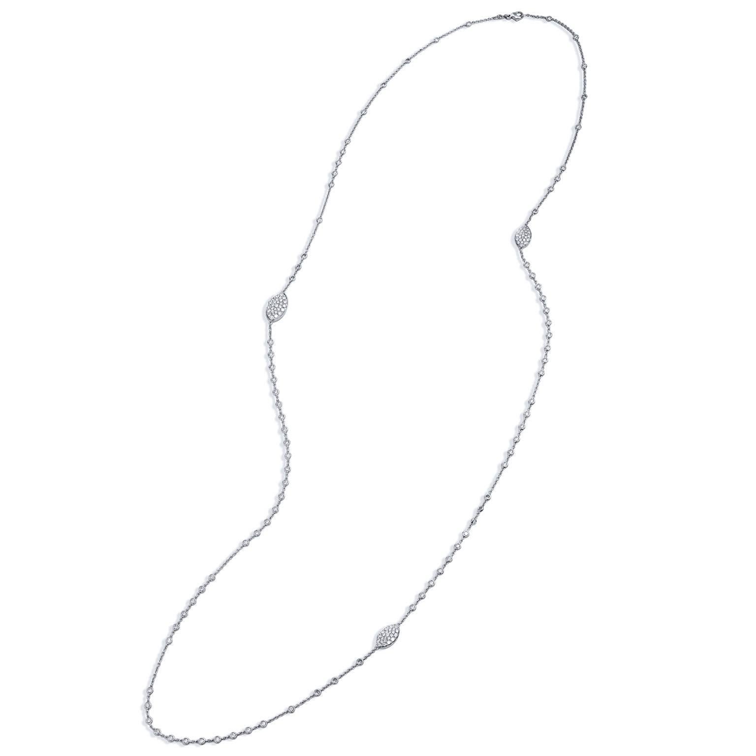 18 karat white gold bezel-set diamond by-the-yard necklace featuring 7.26 carat of diamond (G/SI) bezel set in a casual combination of chain interrupted by bezel set diamonds.  Pave diamonds in oval shape, punctuate throughout the exquisite necklace