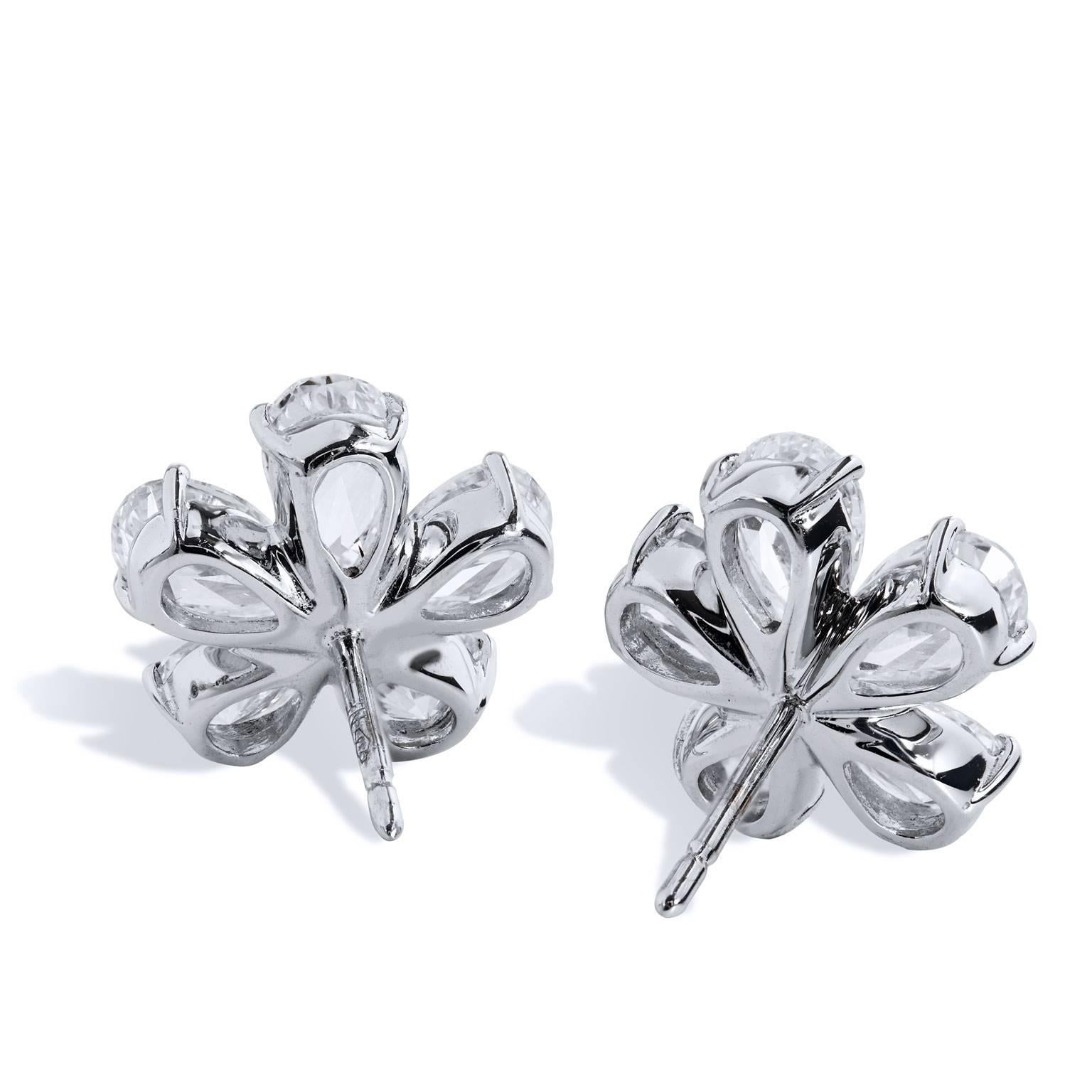 18 karat white gold flower stud earrings featuring a total weight of 4.41 carat of marquise and round diamonds in flower shape (F/SI1).
