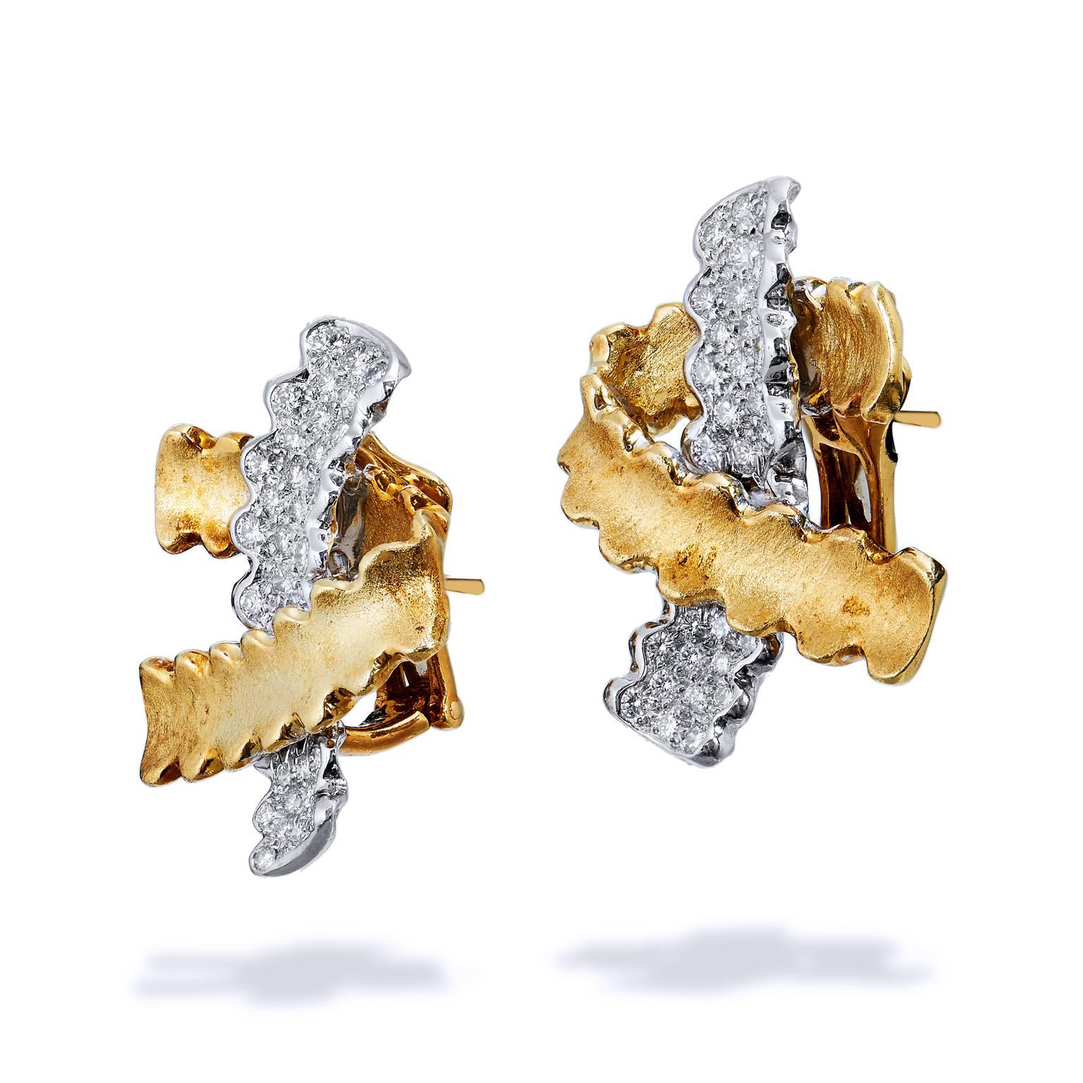 Submerge yourself in the natural realism of Nicholas Varney’s imagination with these previously loved, platinum, 18 karat gold and diamond earrings. Although static, these earrings embody a natural movement, like that of coral swaying on the sea