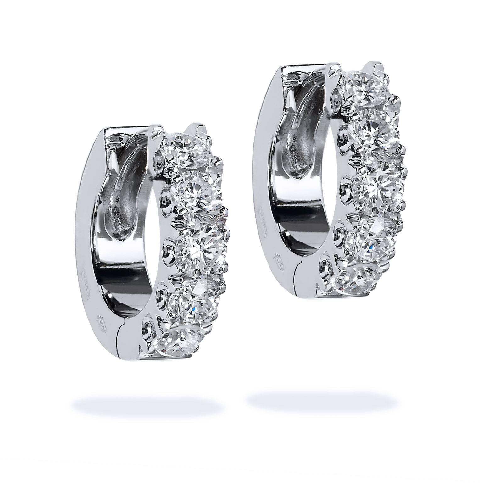 18 karat white gold hoop earrings featuring 1.48 carat of diamond color: G and clarity: SI.