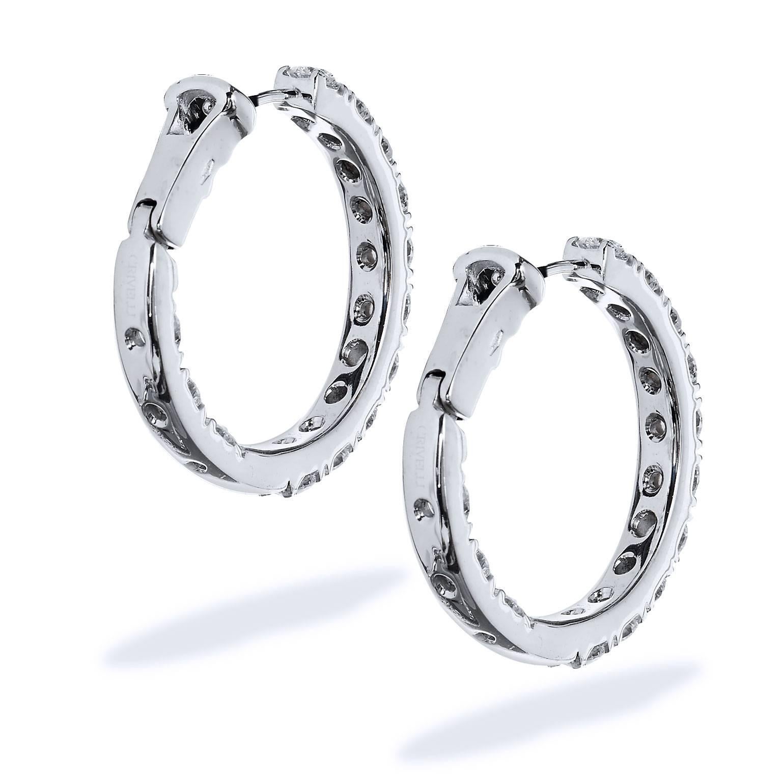 18 karat white gold diamond hoop inside-out earrings featuring twenty-six pieces of diamond for a total weight of 3.15 carat (G/SI). 