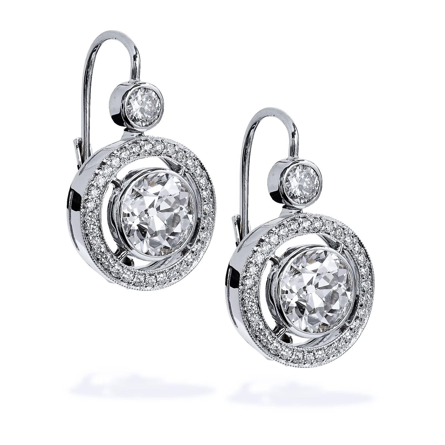  An H and H handmade pair of 18 karat white gold hinged-back earrings that will leave her enamored and enthralled . A total weight of 3.56 carat of Old European Cut diamond (1.72 carat/1.84 carat; L/M/VS) is bezel set at center on floating air line,