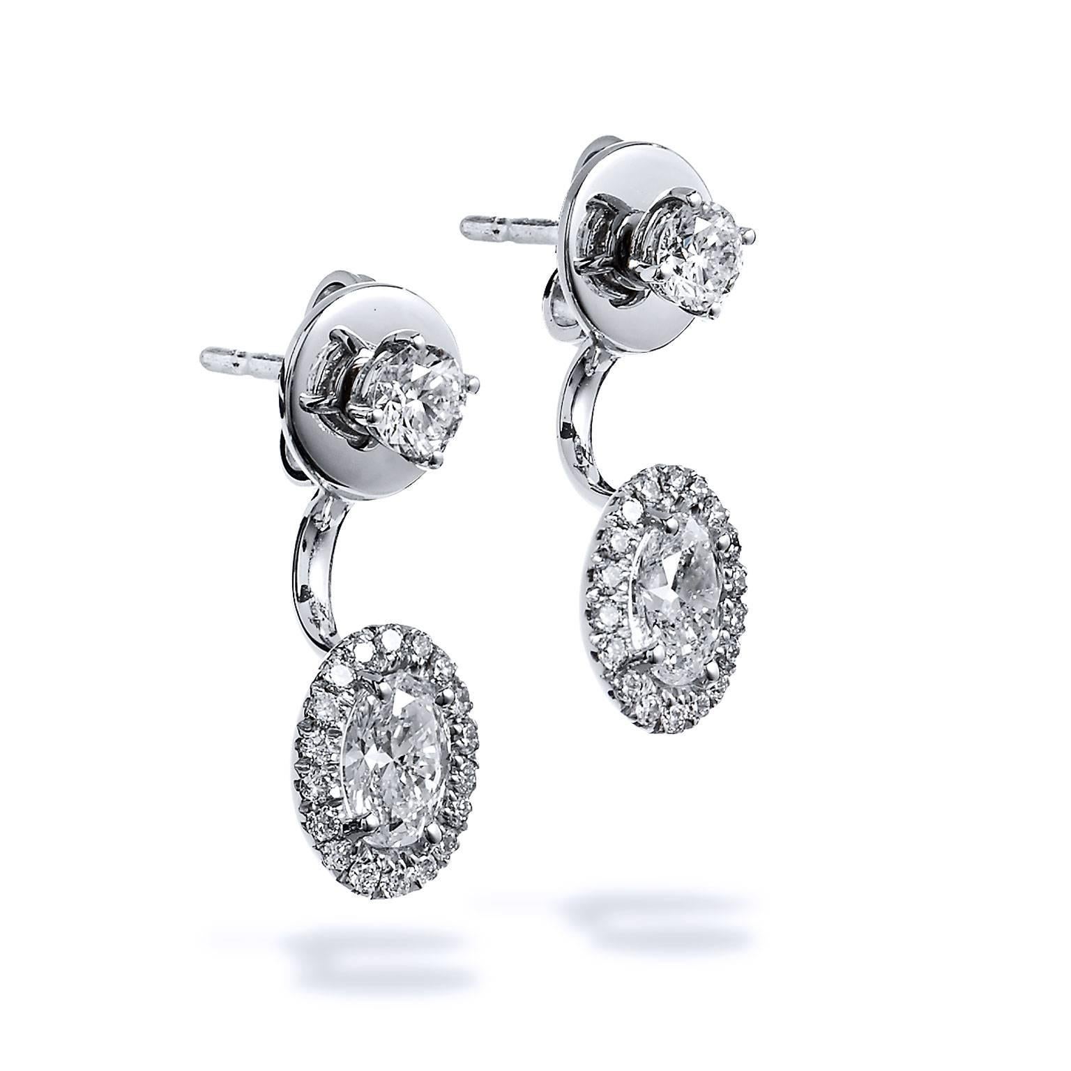 18 karat white gold double-sided stud earrings featuring a total weight of 1.39 carat of diamond. 0.79 carat of oval diamond (F/VS2) is set at center and accompanied by 0.60 carat in pave diamond (G/SI1).