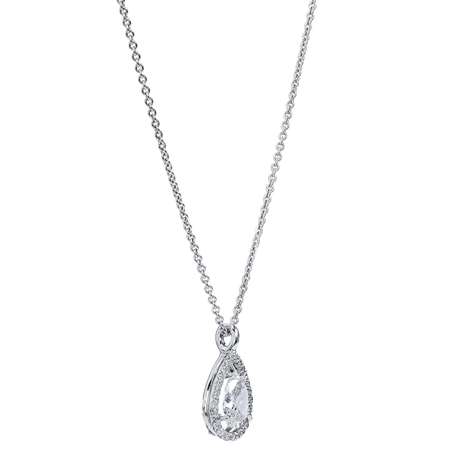 Femininity and refinement reign supreme in this handmade H and H 18 karat white gold and pear cut diamond pendant necklace. An impressive 1.21 carat diamond is set at center in four prong setting (I/VS2; GIA#2175400714). To further enhance this