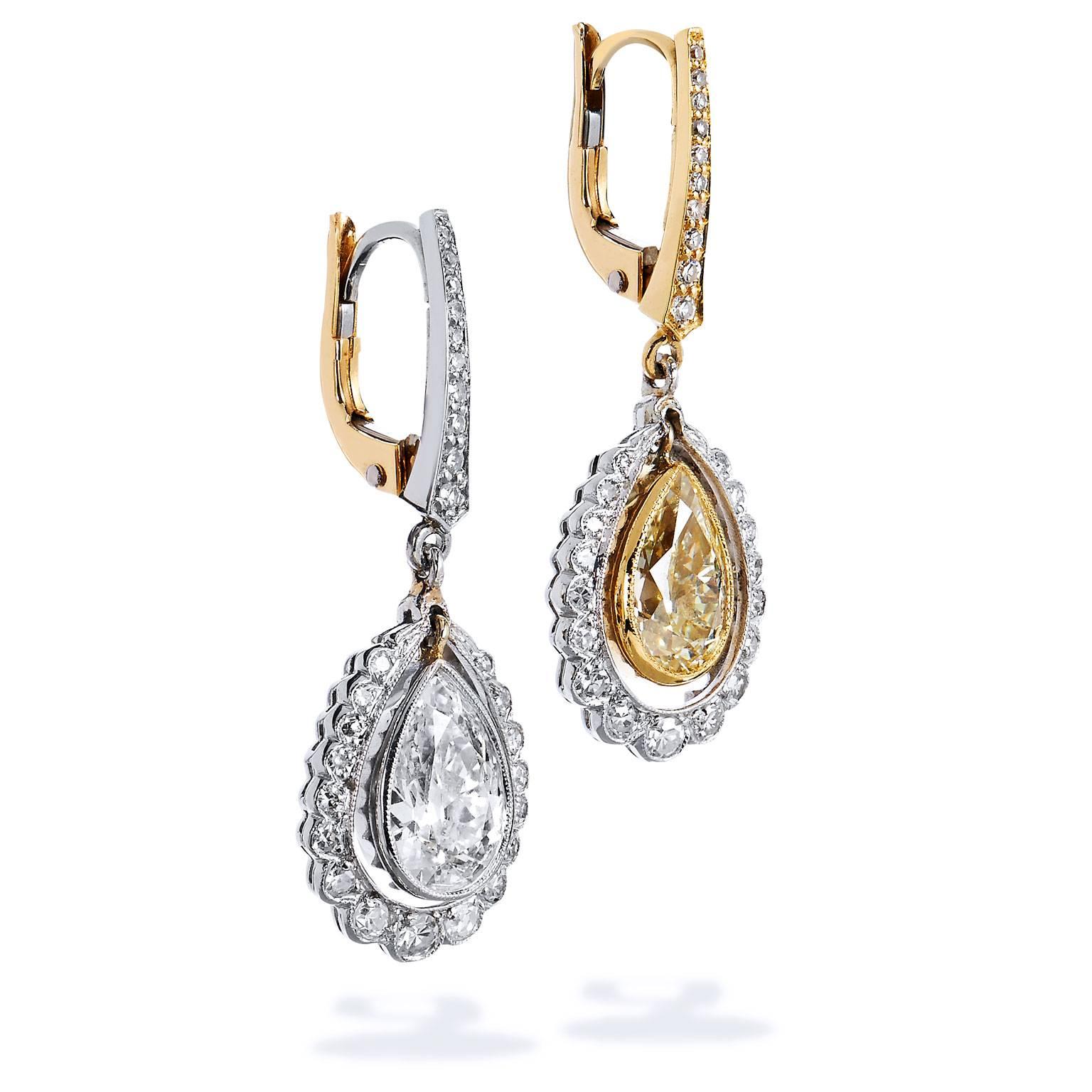 For the woman whose style is classic yet edgy, enjoy these Art Deco inspired lever-back earrings. Handmade by H, these 2.70 carat diamond,18 karat yellow gold and two-tone 18 karat yellow gold and platinum Morphosis dangle earrings epitomize