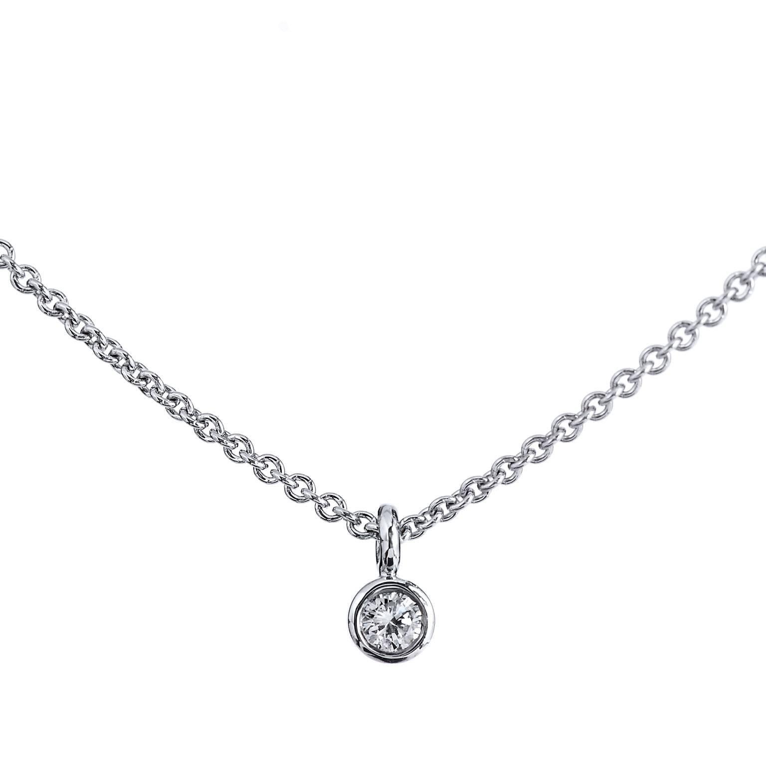H & H Minimal 0.05 Carat Diamond Solitaire Pendant Necklace

This H and H 18 karat white gold pendant features a lovely 0.05 carat round brilliant cut diamond at center bezel set (H/I). Simplicity and refinement reign supreme in this piece.  The