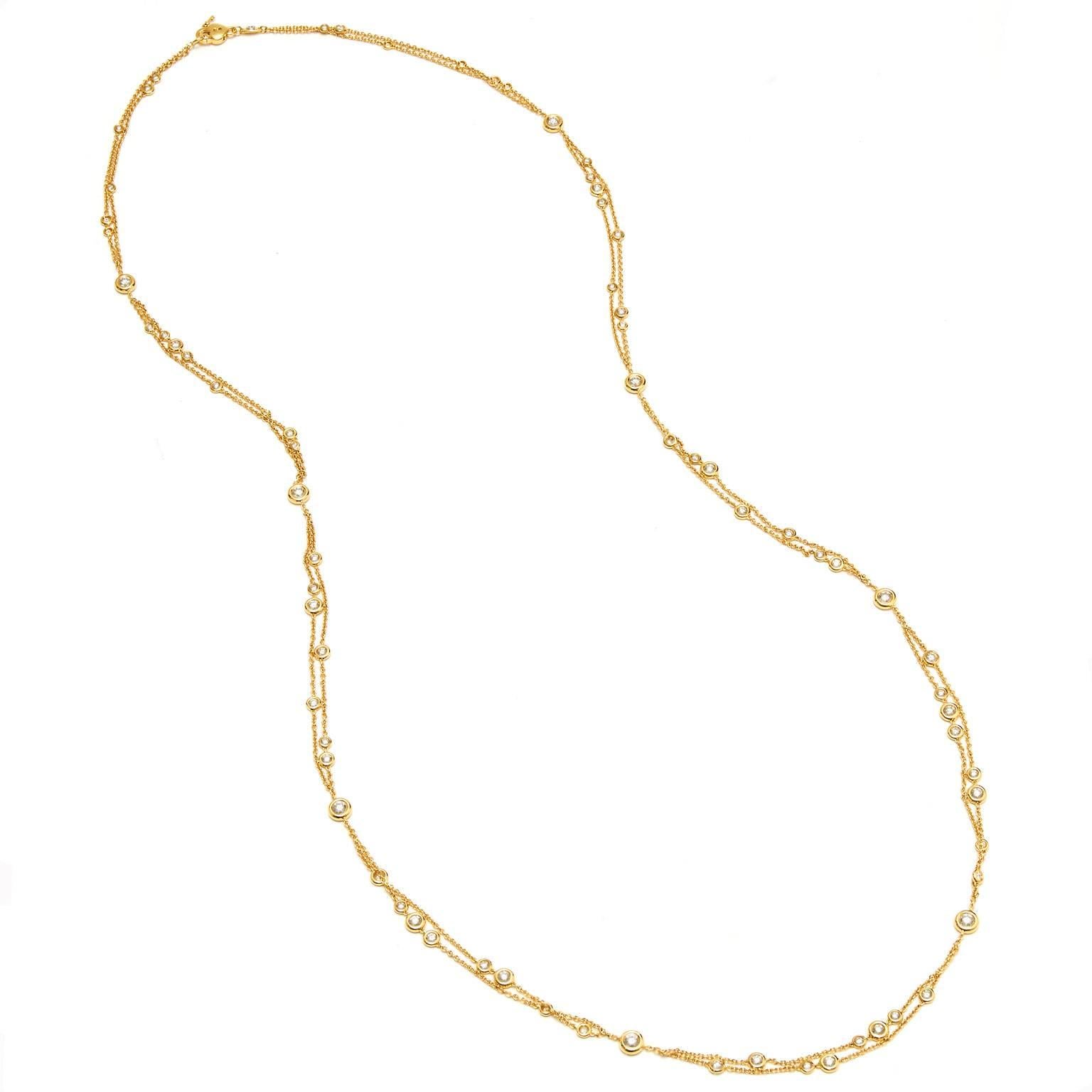 18 karat yellow gold necklace featuring 5.56 carat of diamond bezel set (G/SI1).