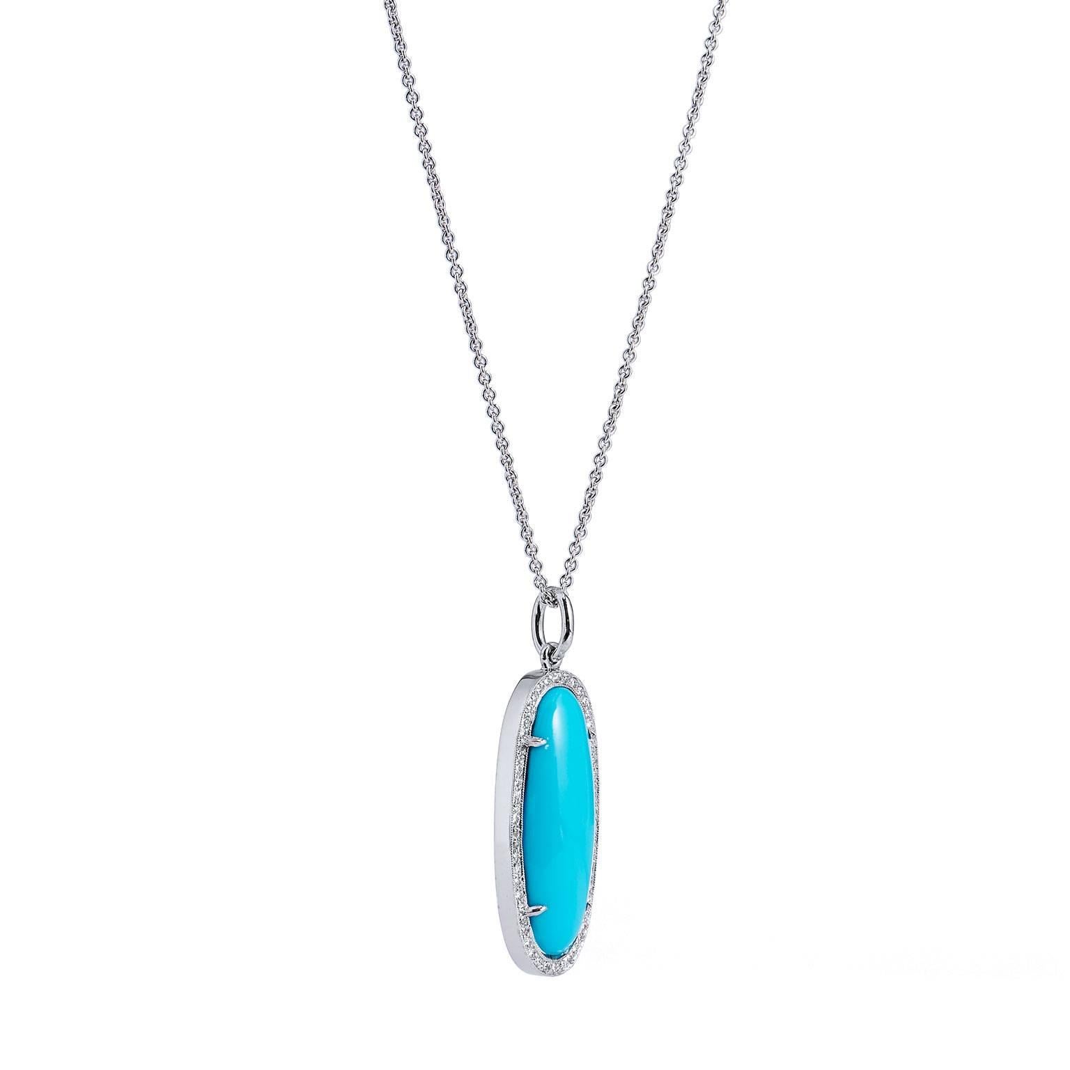 A striking synthetic turquoise is set at center and fashioned in 18 karat white 
gold in this handcrafted H and H pendant. Turquoise is a stone of protection- strong and opaque, yet soothing to the touch. It appears as if though it was carved from