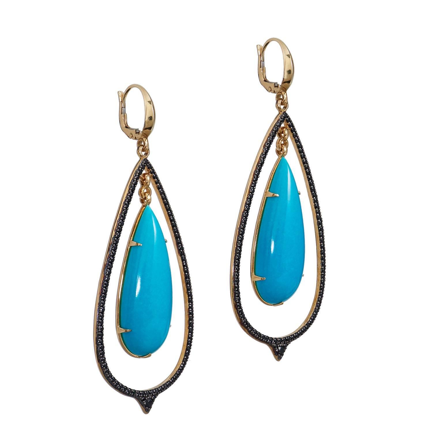 Large 14 Karat Gold Turquoise Double-Drop Spinel Pave Set Lever Back Earrings

These glamours earrings are created with 14 karat yellow gold.  They have a double drop hoop that features 2, 35.1 mm x 12.9 mm pear-shaped turquoise drops.

The outer