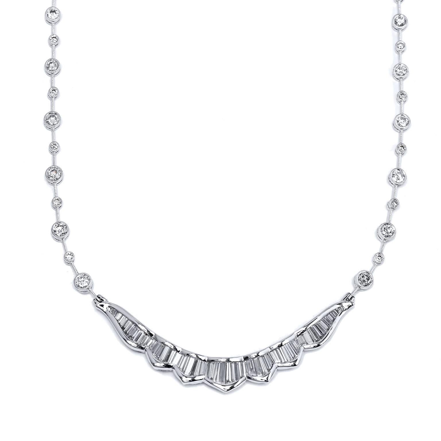 Enjoy this previously loved 18 karat white gold necklace featuring a total weight of 4.58 carat in diamond. 2.08 carat of individually bezel set diamond (I/J/SI1) stream like drew drops as they pool into a stream of 2.50 carat of channel set