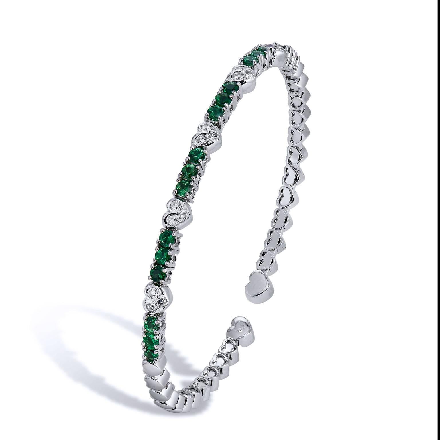 Enjoy this previously loved 18 karat white gold bracelet featuring eighteen pieces of green tsavorite and 0.22 carat of pave set diamond (F/G/SI1). Let a little green envy inspire your style.