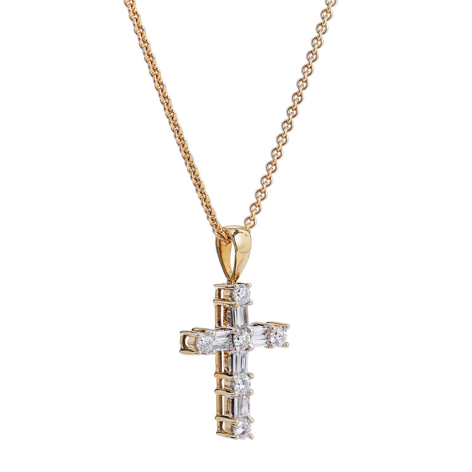 Enjoy this previously loved 14 karat yellow gold cross pendant necklace featuring a total weight of 1.00 carat of round and baguette cut diamonds (G/H/SI2) prong set in a beautiful display.

